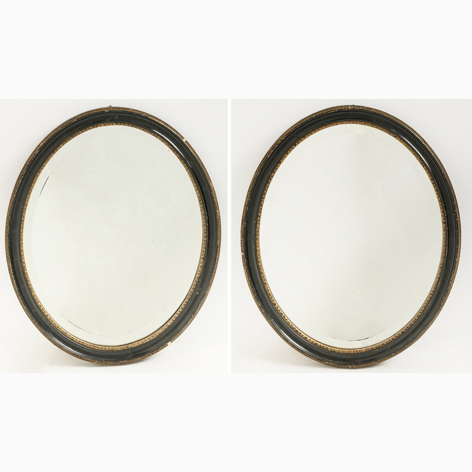 Pair of Irish Parcel Gilt and Ebonized Wood Oval Mirrors (1 of 6)
