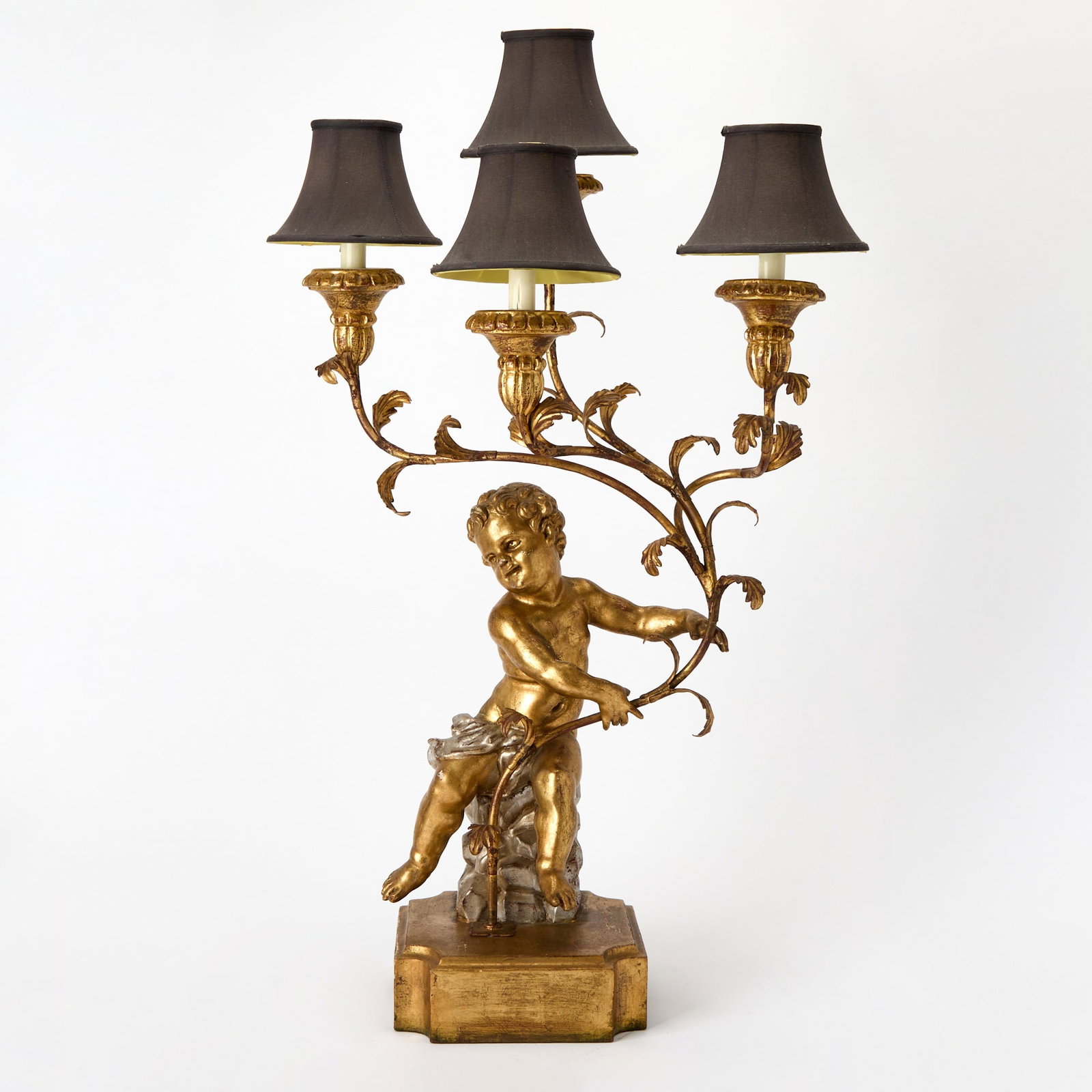 Italian Baroque Style Carved Giltwood Candelabrum: With Standard in the form of a Putto, electrified. 20th century Height 34 inches, width 9 inches, depth 9 inches