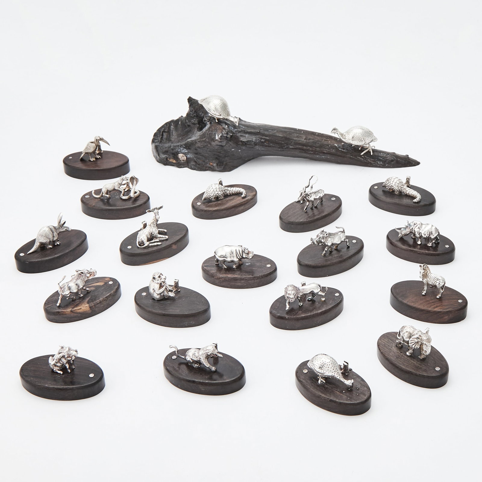 Group of Patrick Mavros Sterling Silver and Dark Stained Wood Table Ornaments: Comprising a centerpiece and eighteen placecard holders. Length of centerpiece 9 1/2 inches, length of placecard holders 2 1/4 inches, weighted.