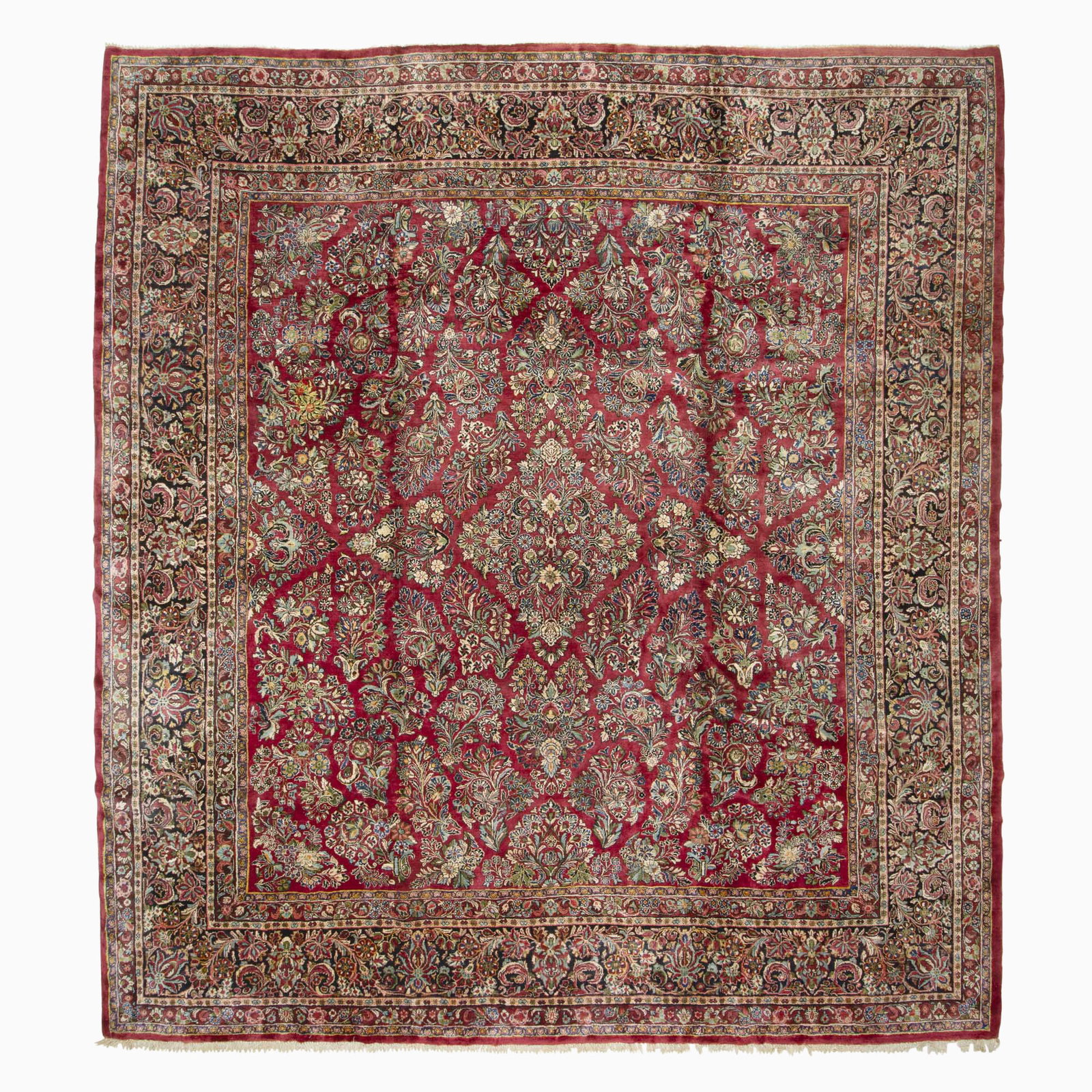 Sarouk Carpet: North Iran, Mid-20th Century The crimson field with a central medallion flanked by sprays is within a midnight blue palmette and vine border. (13' 10" x 12' 3") Stains