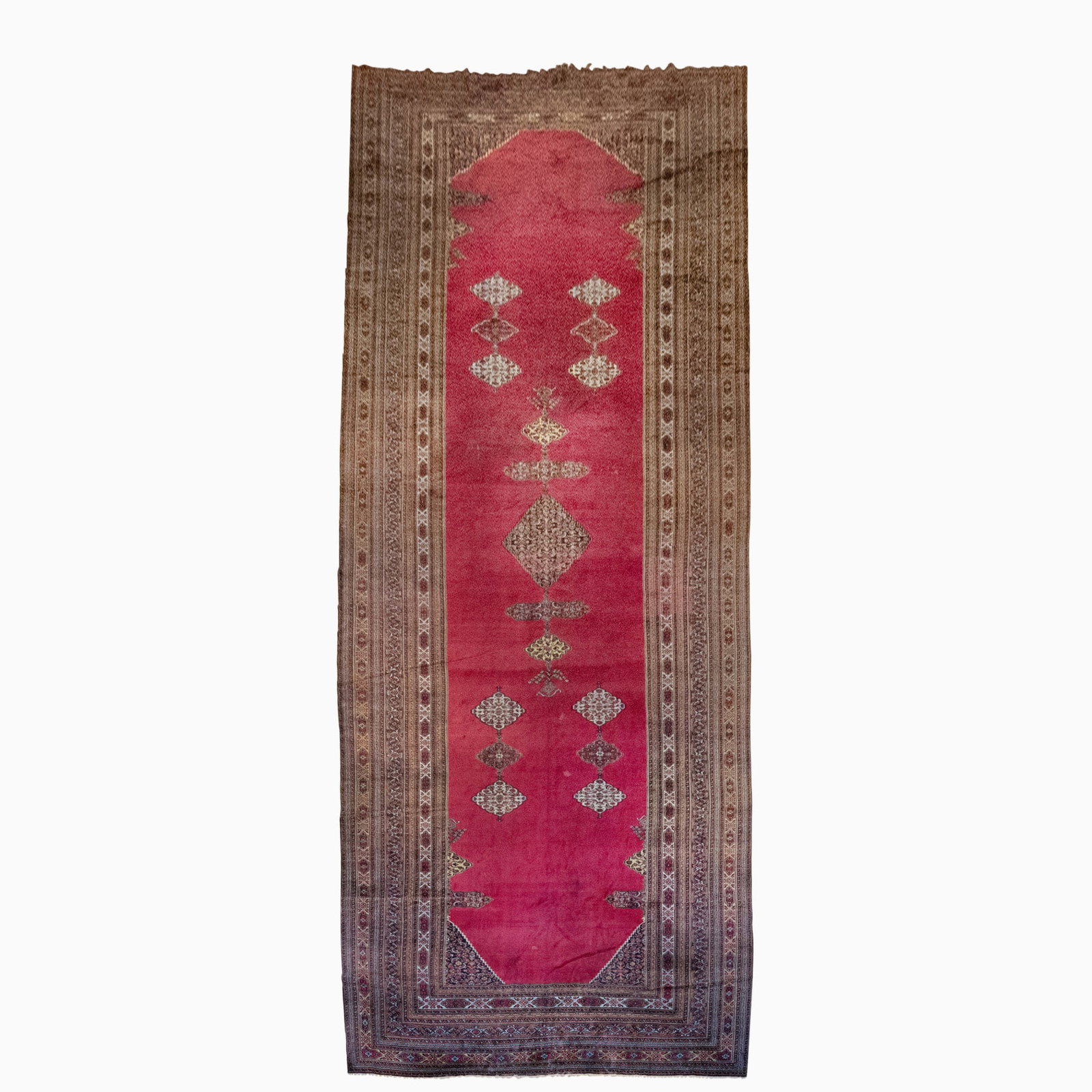 Khorassan Carpet: Northeast Persia, Late 19th Century The central pendant medallion on the magenta field is within a palmette and vine border. (31' 3" x 10' 8") Areas of wear, re-piled areas, stains