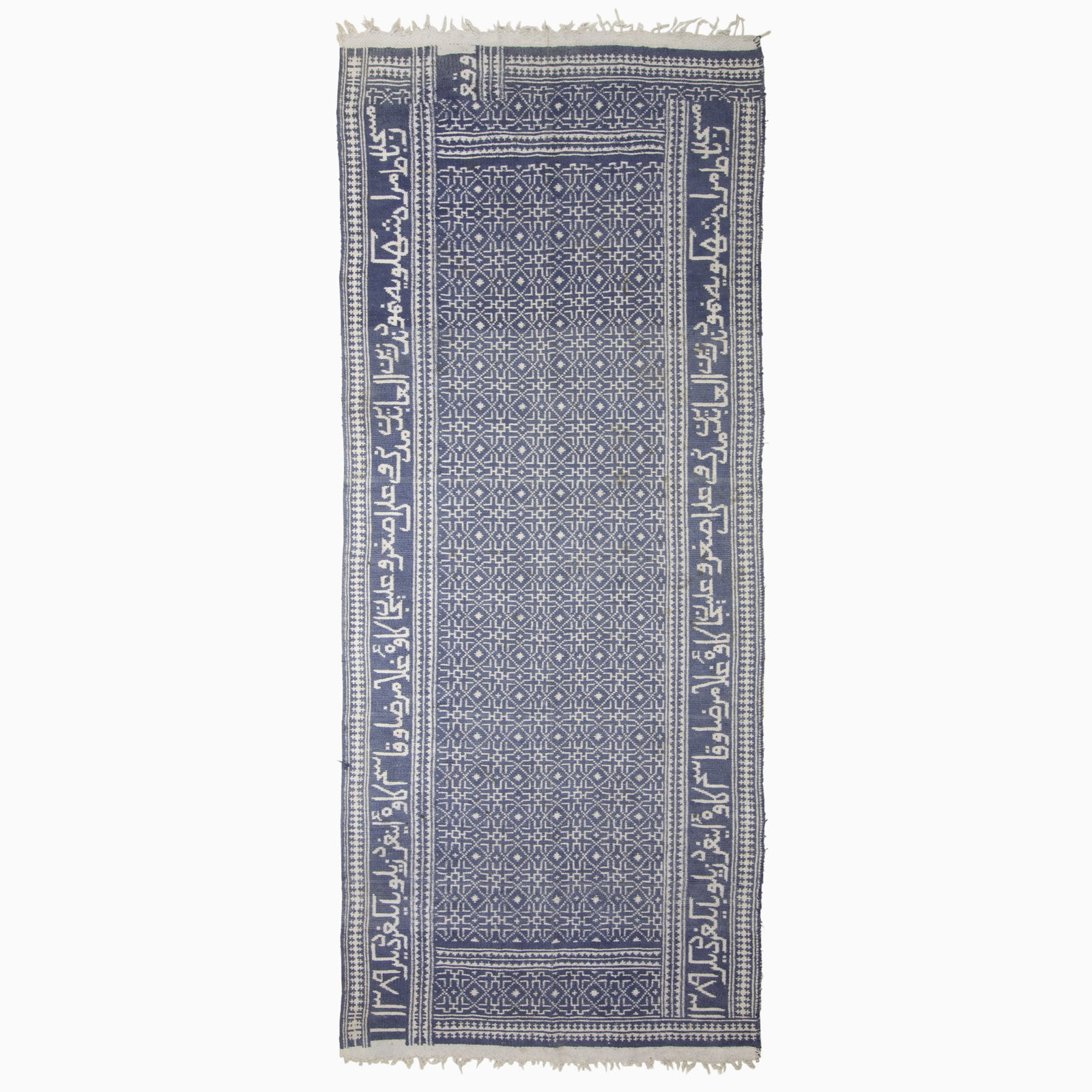 Persian Zilo Cotton Double-Sided Kilim: South Iran, Mid-20th Century Woven in ivory and indigo with an overall rosette pattern within an inscription-filled border. (14' 1" x 5' 10") Faint stains, spot stains