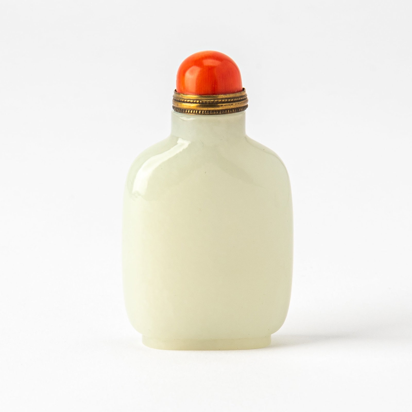 A Chinese White Jade Snuff Bottle 19th Century: Of flattened form with gently sloping shoulders; unadorned. (Height 2 3/4 Inches)