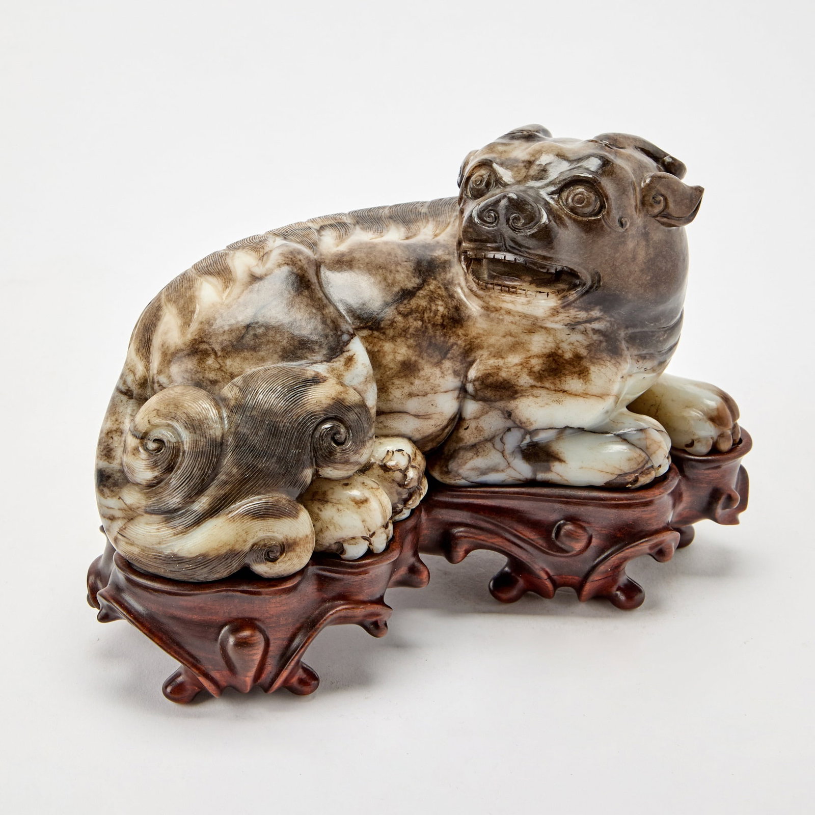 A Chinese Carved Mottled Jade Beast