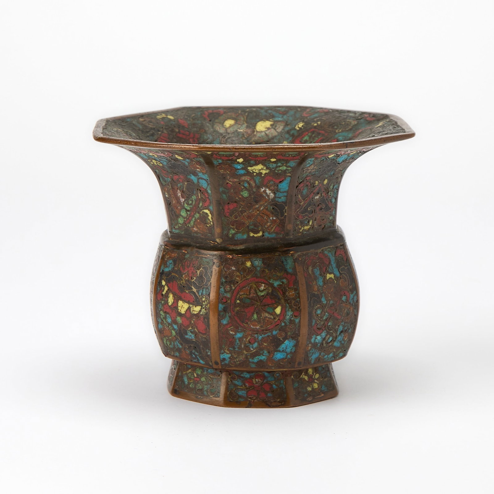 A Small Chinese Cloisonne Enamel Zhadou Ming Dynasty: Of faceted octagonal form, decorated with the Eight Buddhist Emblems against a dense ground of scrolling floral motifs. (Height 4 inches)