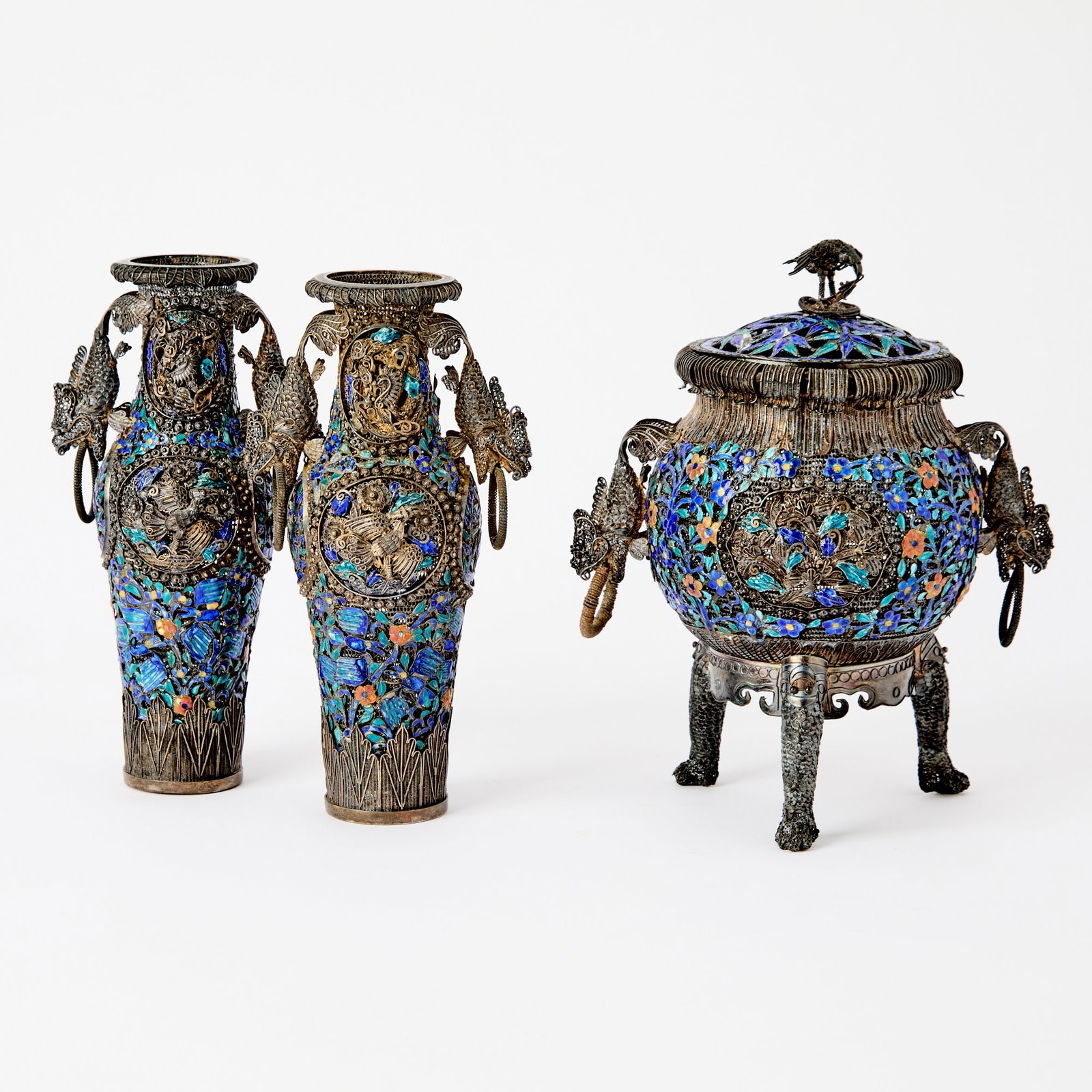 A Chinese Silver Filigree and Enamel Three-Piece Garniture Qianlong Mark and of the Period: The vented bodies decorated with birds among scrolling leafy vines bearing florets. (Height of largest 6 1/4 inches)