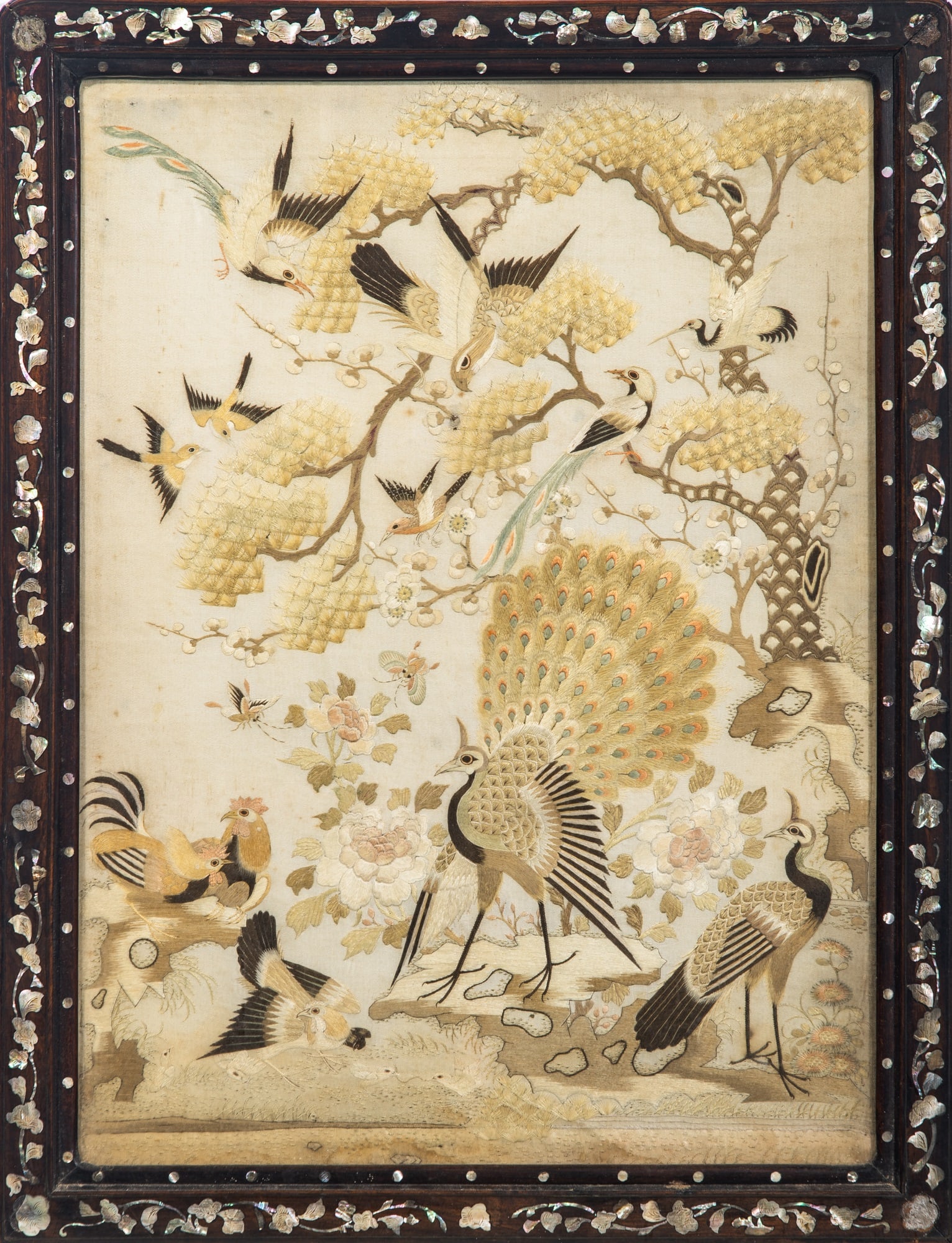 A Chinese Embroidered Silk Screen Panel Late Qing Dynasty: Decorated to show a variety of birds amidst blossoming branches. (Sight 19 1/4 x 25 1/4 inches)