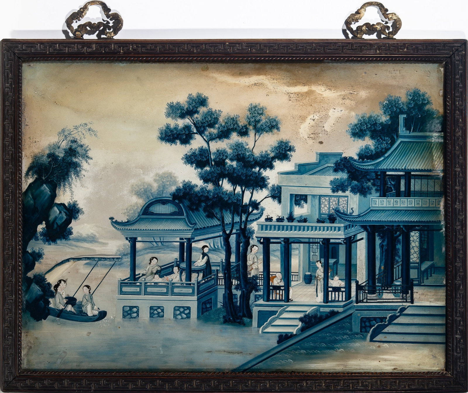 A Chinese Reverse Glass Painting Qing Dynasty: Depicting a gentleman, ladies, children and attendants in a pavilion complex beside a lake. (Sight 32 x 23 1/2 inches)