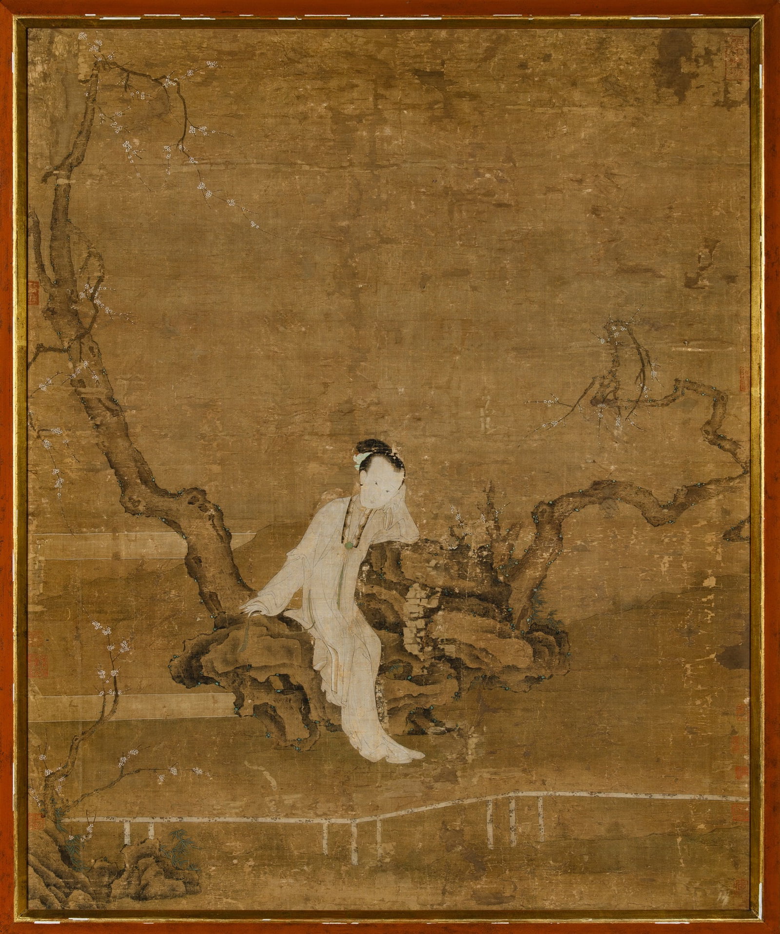 A Chinese School Painting of a Meiren Ming Dynasty, 17th century: Ink and color on silk Depicting a beauty seated upon a rocky outcrop, beneath twisted and sweeping branches, lost in contemplation Eleven seals along the edges, some partially cropped (Sight 38 3/4 x 