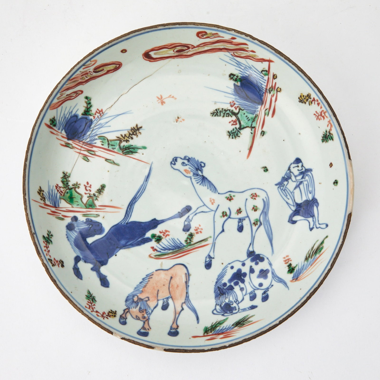 A Chinese Wucai Porcelain Plate Transitional Period: Decorated with four horses and a boy playing the flute. (Diameter 8 inches)