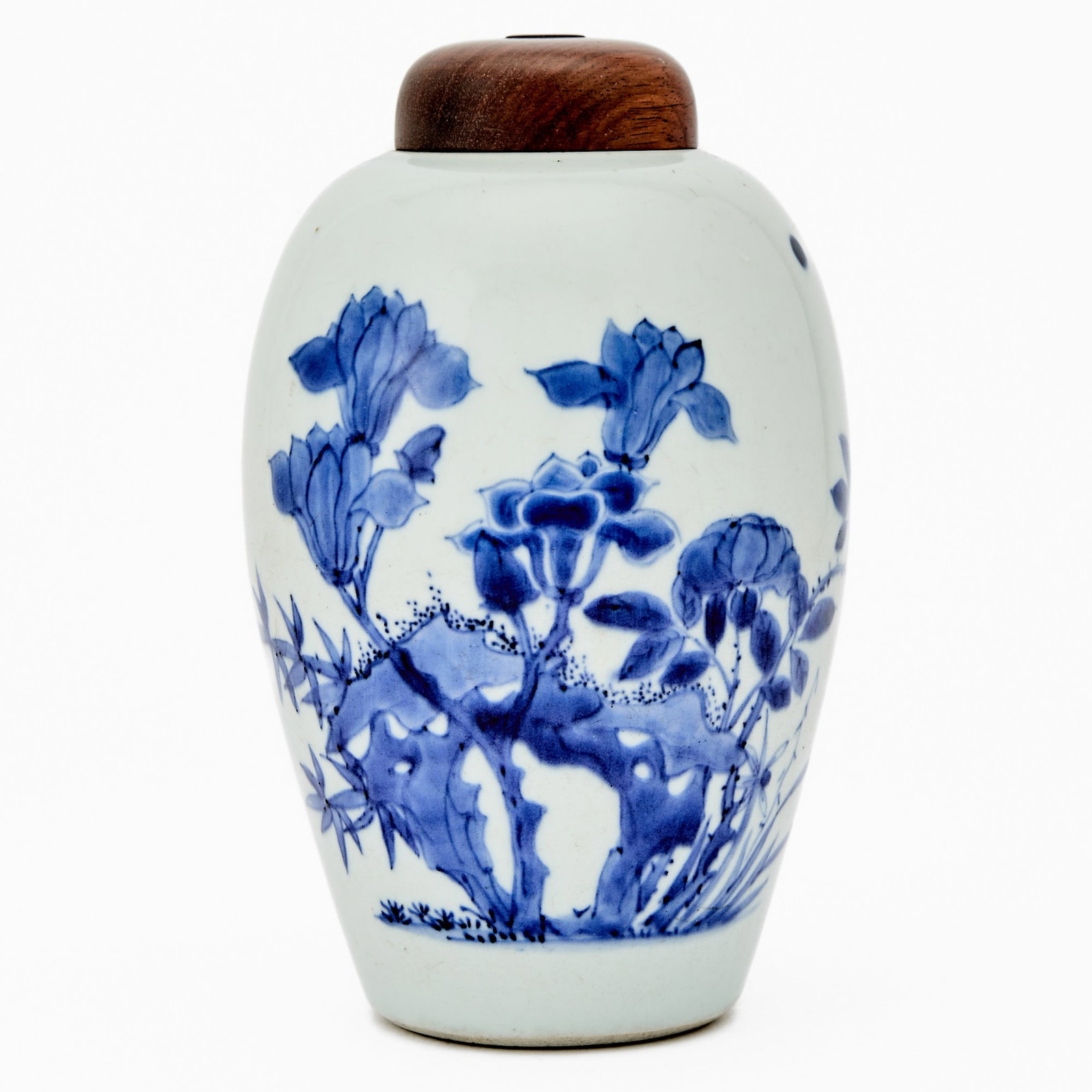 A Chinese Blue and White Porcelain Ovoid Jar 17th Century: Decorated with blossoming branches issuing from rockwork, accompanied by three birds at one side. (Height 7 1/4 inches)