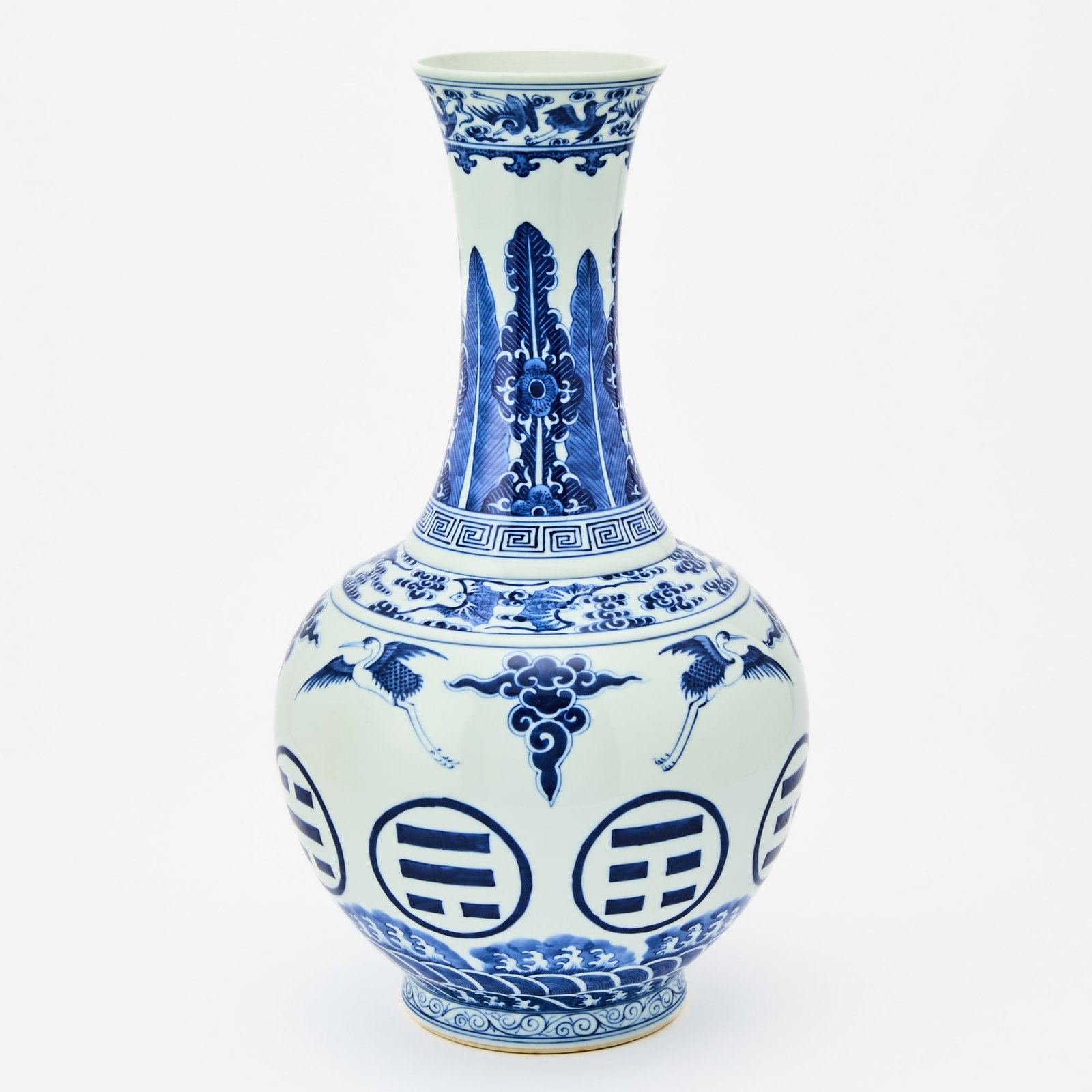 A Chinese Blue and White Porcelain 'Crane and Bagua' Bottle Vase Yongzheng Mark, 19th Century: The globular body rising to a concave neck, adorned with the classical design between decorative bands. (Height 15 inches)