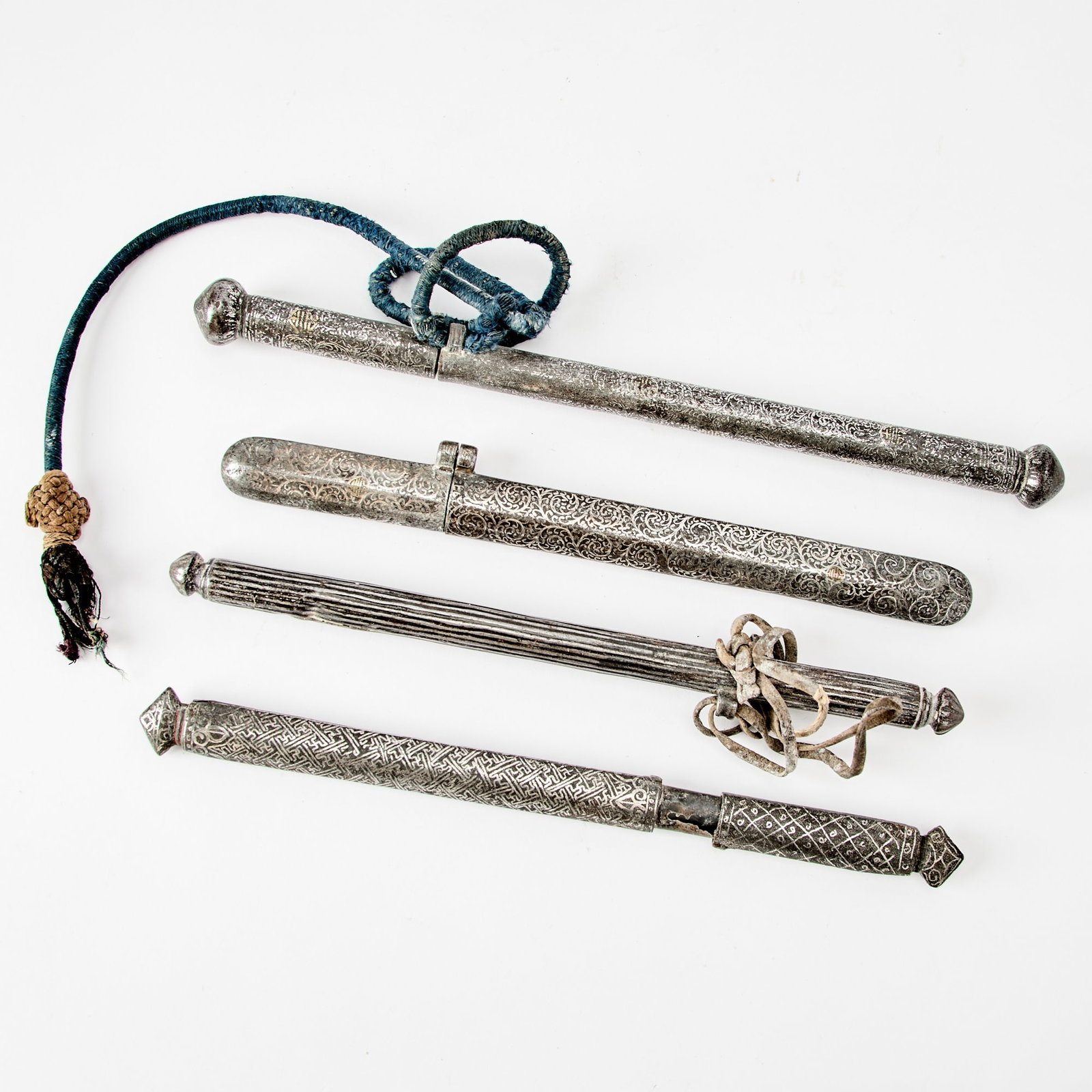 Four Indian Bidri Ware Silver and Brass-Inlaid Alloy Scroll Holders for the Sino-Tibetan Market