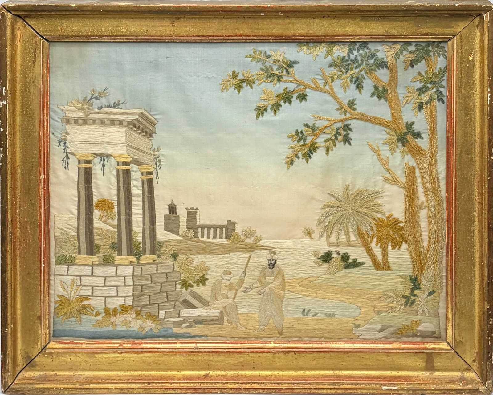 French Needlework Picture on Silk of a Classical Scene: Early 19th Century Depicting two figures among ruins. 14 1/2 x 11 1/2 inches Framed 18 1/4 x 14 1/2 inches