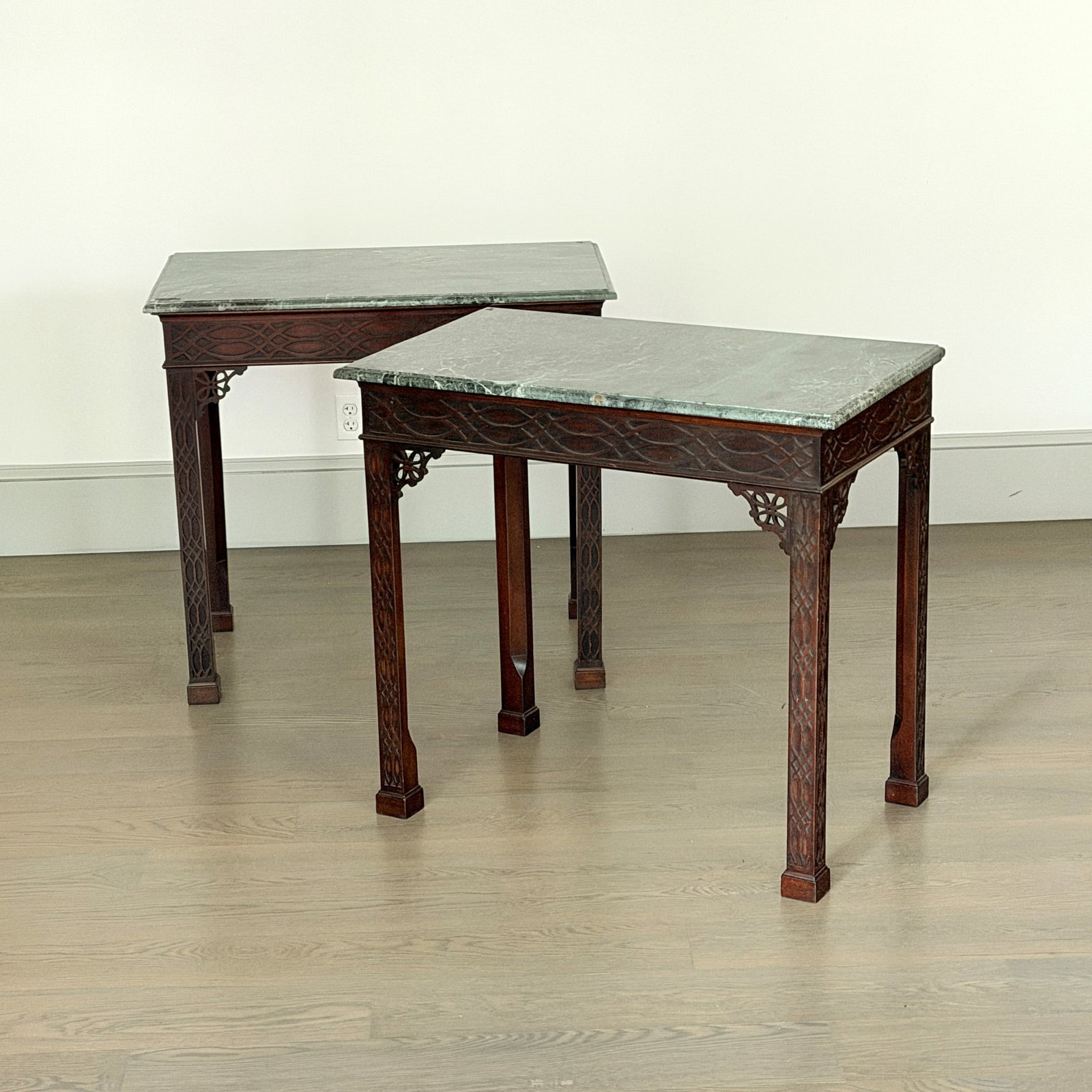 Pair of Chinese Chippendale Style Mahogany Marble Top Tables: Mid 20th century Height 33 inches, width 36 inches, depth 20 3/4 inches.