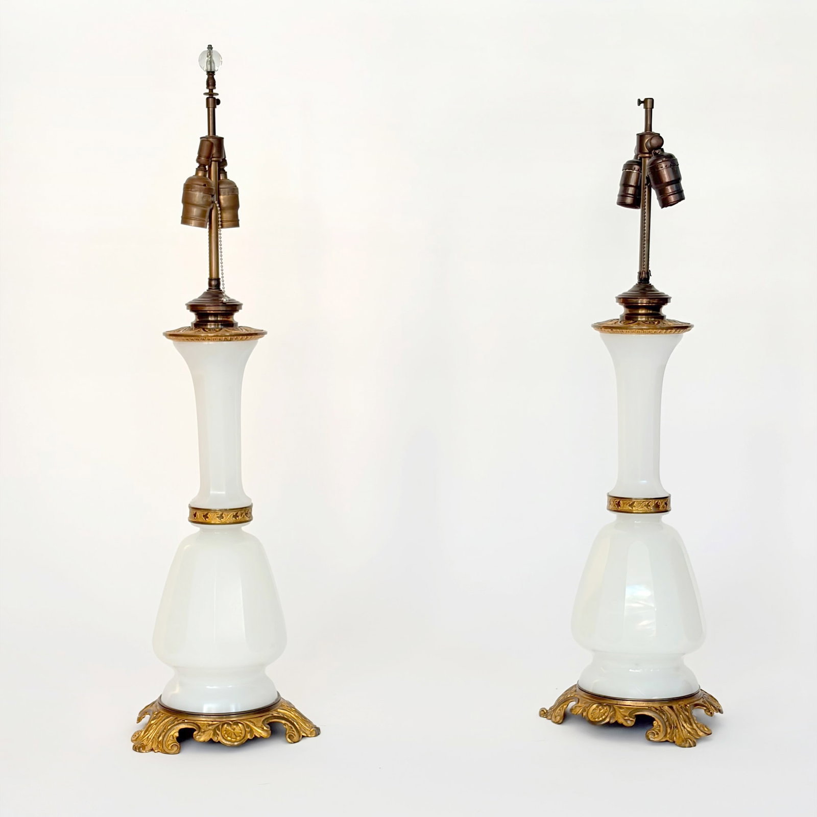 Pair of Opaline Glass and Gilt Bronze Lamps: Late 19th/early 20th century Each with faceted neck. Height to upper bronze mount 20 inches.