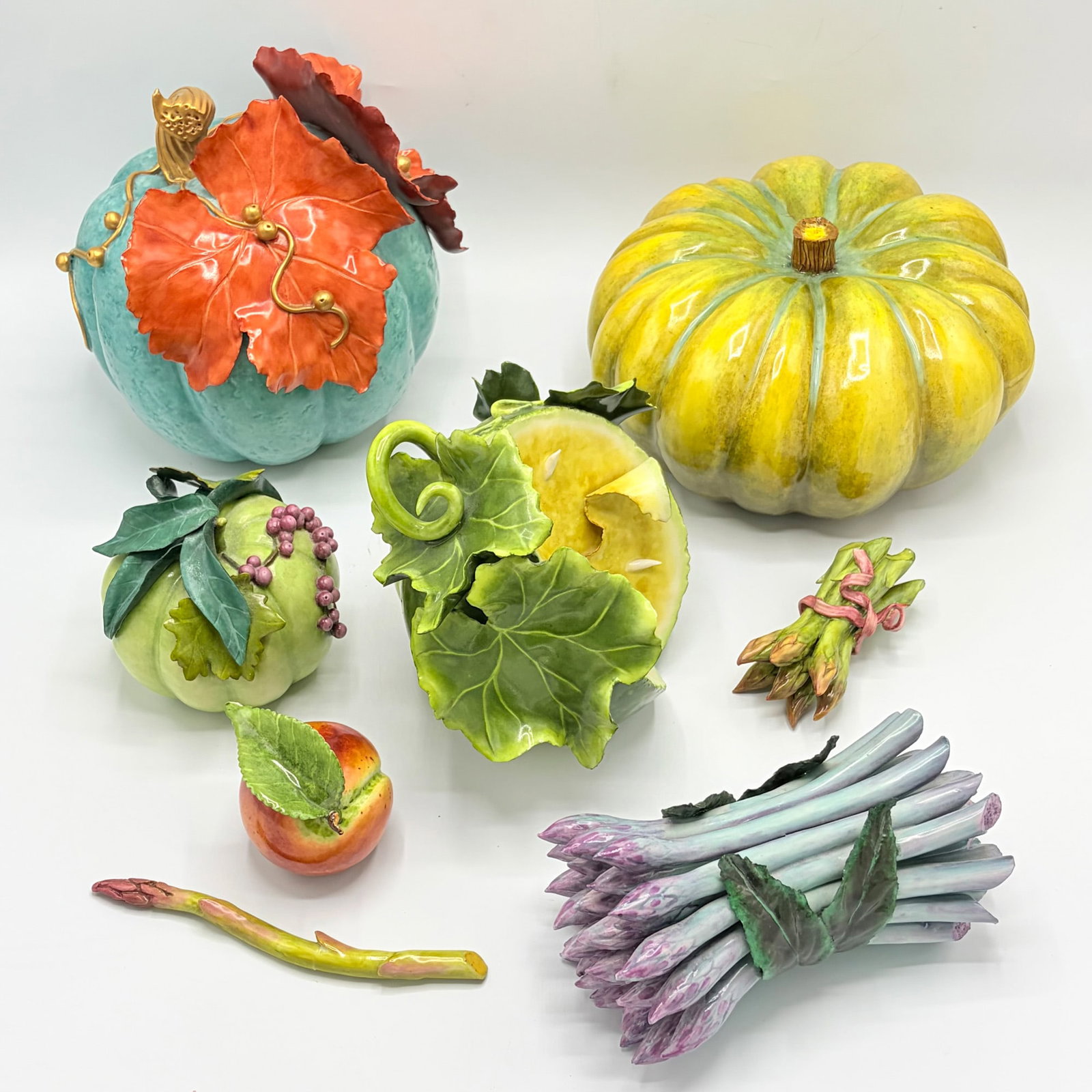 Eight Katherine Houston Porcelain Models of Fruits and Vegetables: Each marked on the bottom. Height of largest 8 1/2 inches. Single asparagus broken and repaired.