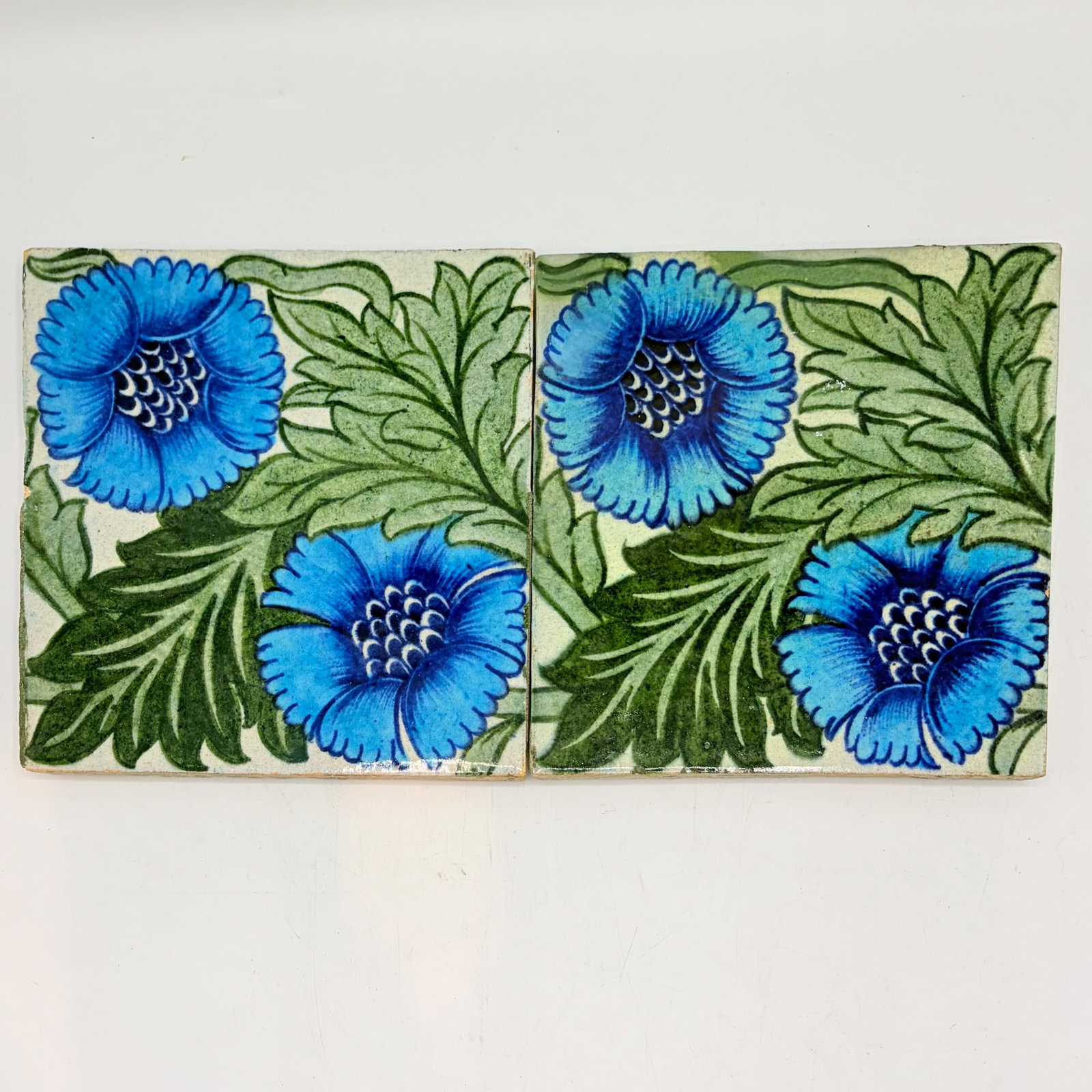 Two William de Morgan Glazed Earthenware "K.L Rose" Tiles: England, circa 1882-1888 Each with impressed De Morgan Merton Abbey mark to reverse Each 6 x 6 inches. mark h, ill. Catleugh (p. 98).