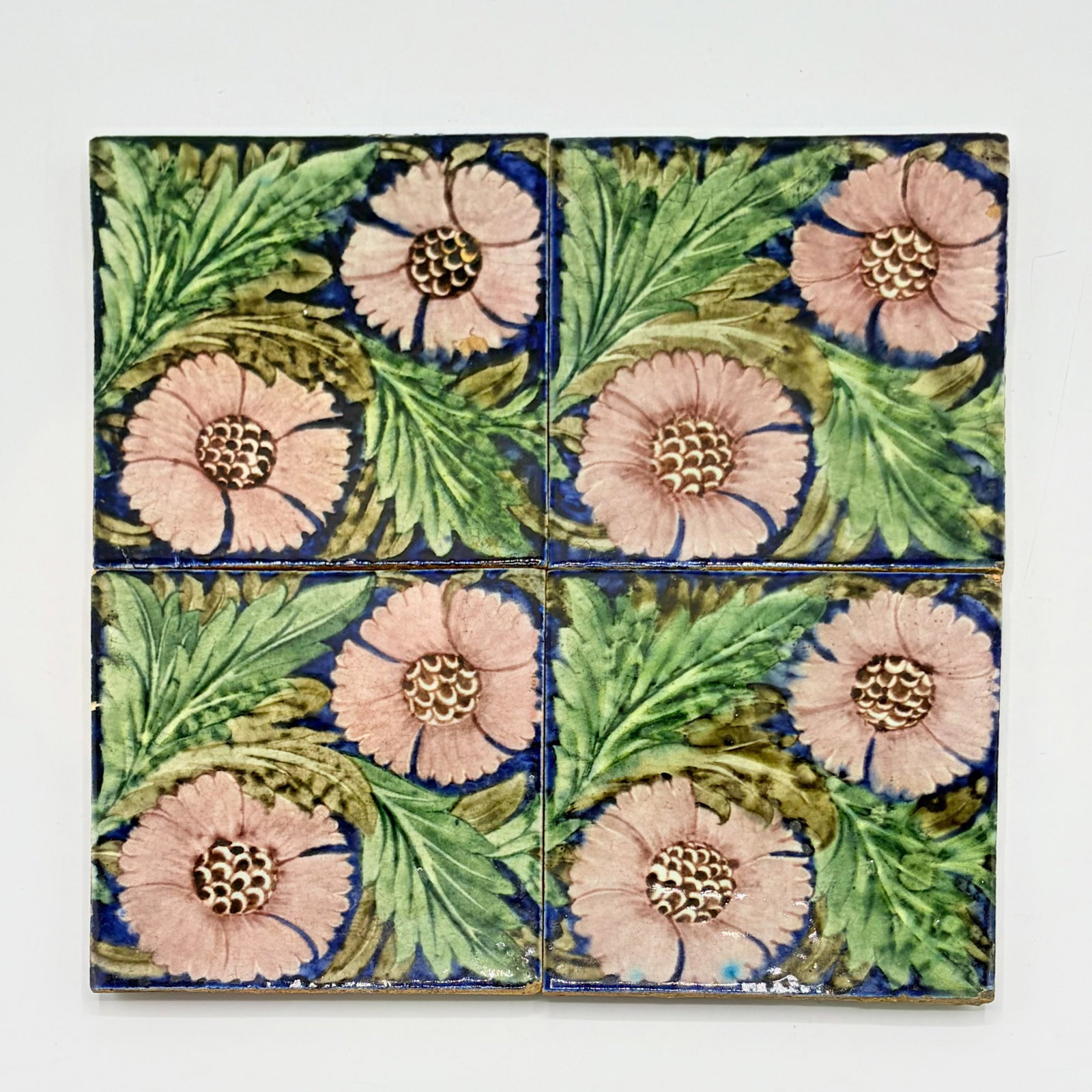 Four Glazed Earthenware William De Morgan "K.L. Rose" Tiles: England, circa 1888-1898 Each with an impressed Sand's End Pottery mark to the reverse. Each 6 x 6 inches. mark k