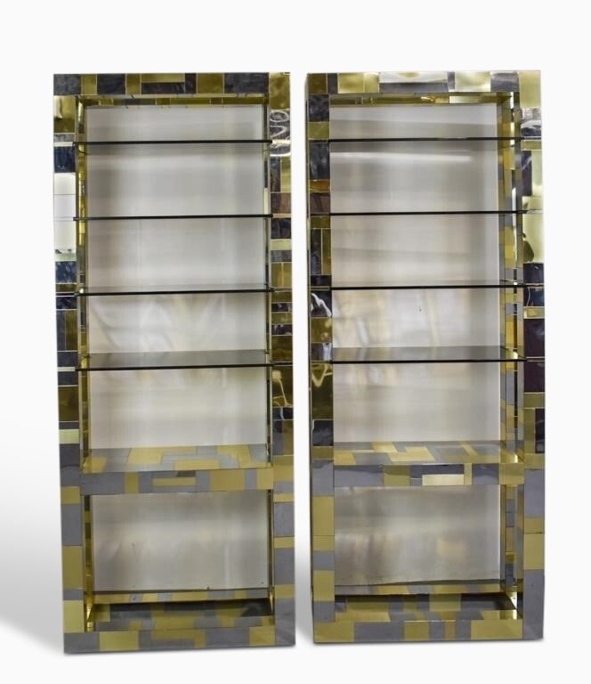 Pair of Paul Evans "Cityscape" Chromed Steel, Brass, and Glass Bookshelves: 1970s Each in polished finish. Height 7 feet 10 inches, width 38 inches, depth 16 1/2 inches. some sections reattached and with damage, one shelf sits slightly off flush.
