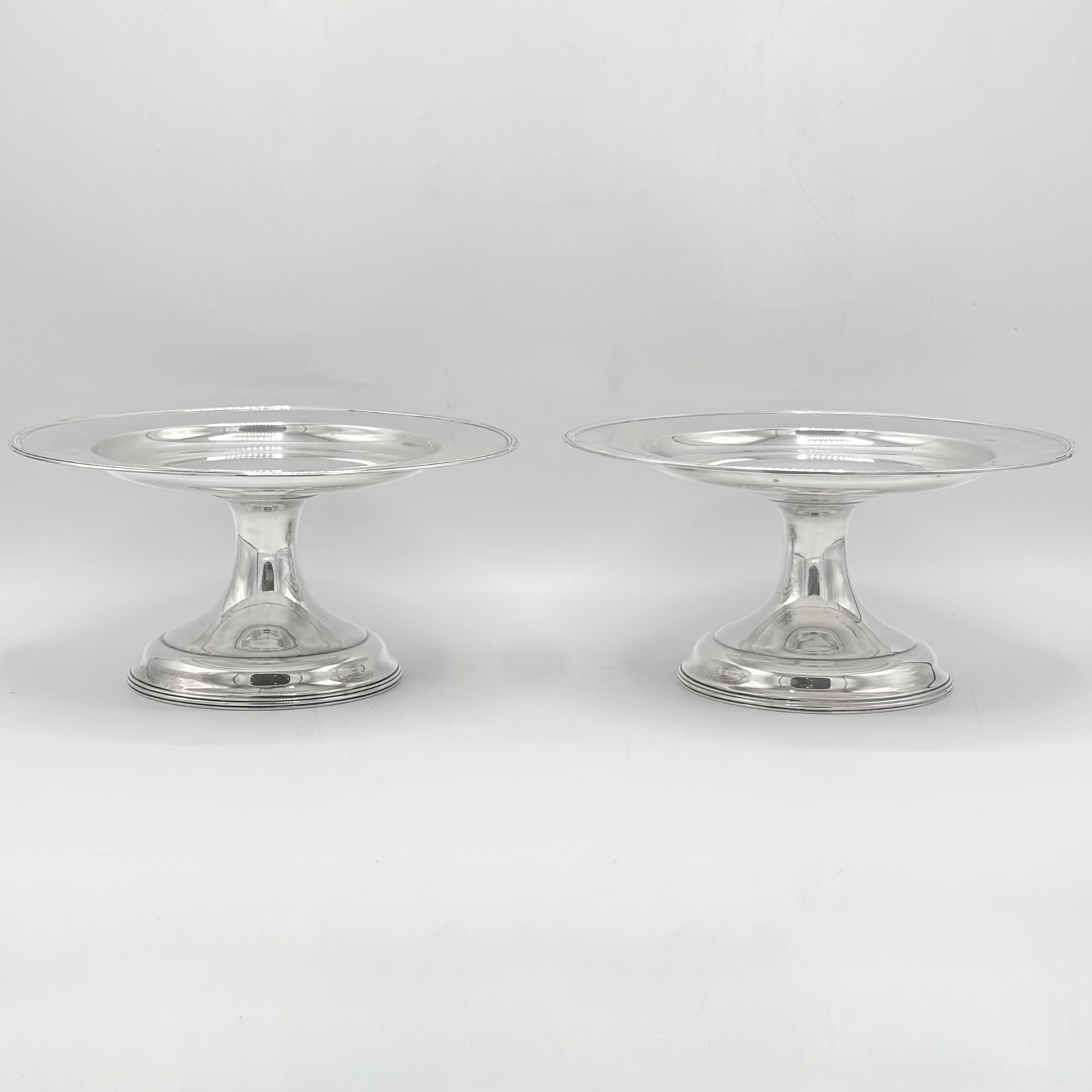 Pair of American Sterling Silver Tazzas: Rand & Crane, Boston, first quarter 20th century Each circular on a domed circular foot. Height 4 inches, diameter 8 1/2 inches, total approximately 26 ounces.