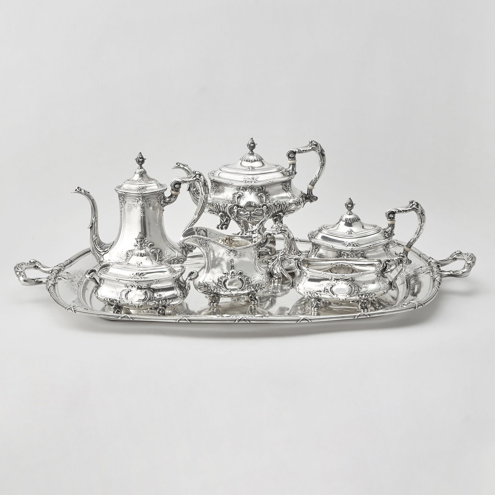 Gorham Sterling Silver Tea and Coffee Service: Early 20th century Comprising a teapot, coffee pot, height 9 3/4 inches, cream jug, covered sugar bowl, waste bowl, kettle-on-stand, and two-handled tray, length over handles 32 1/2 inches, total
