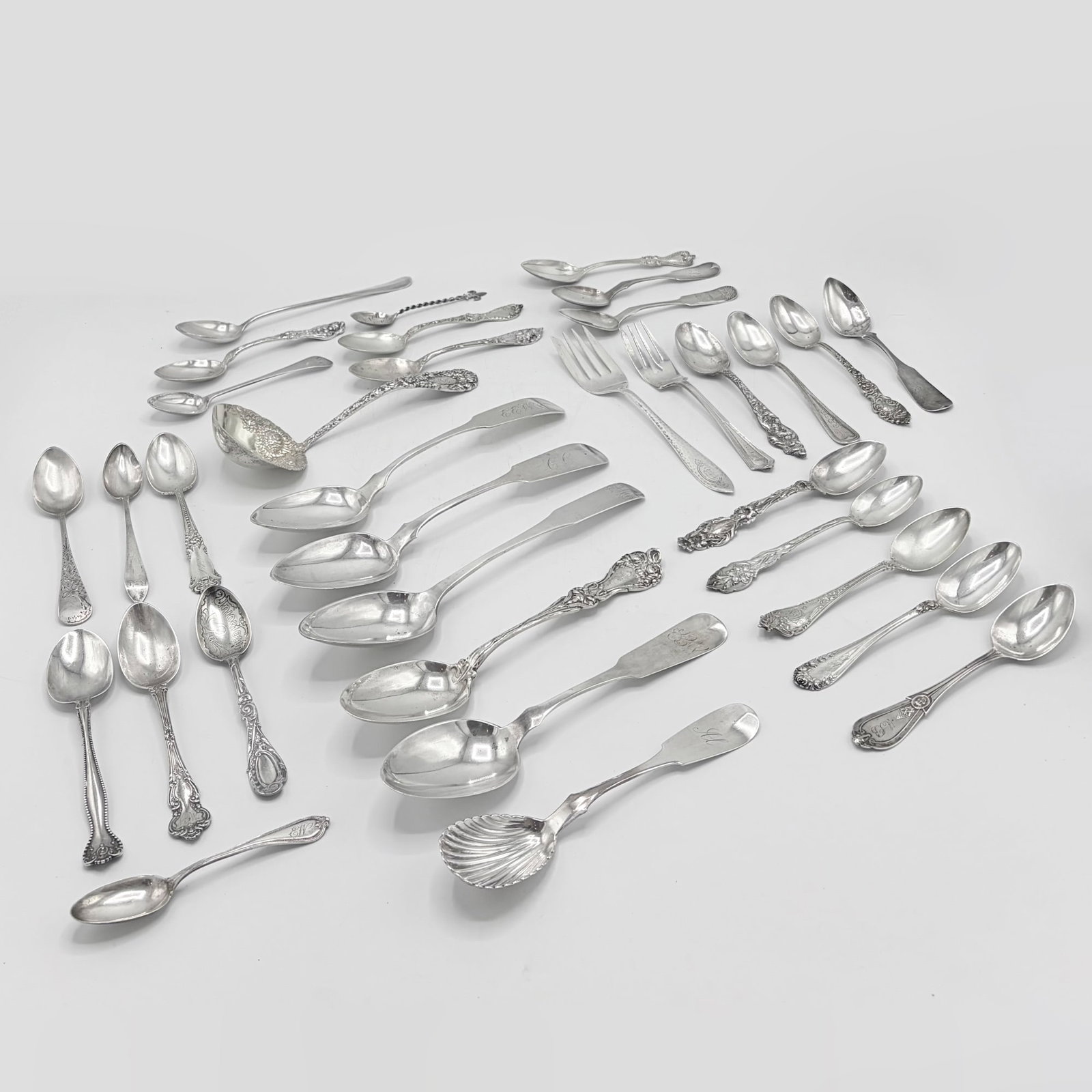 Group of Silver Flatware: 19th/20th Century, various makers and patterns Including forks and spoons. Approximately 60 pieces. Total approximately 60 ounces, weighable.
