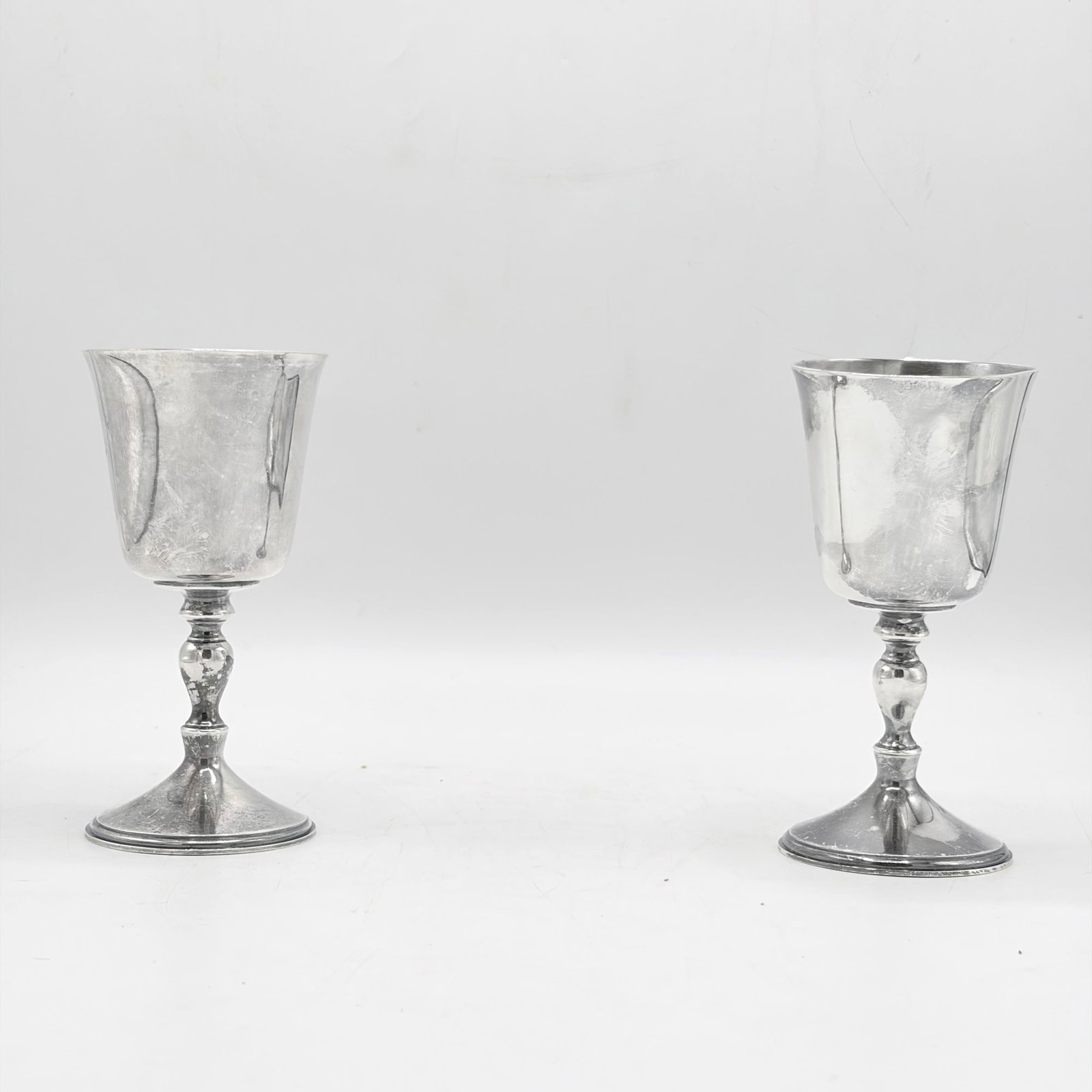 Pair of Elizabeth II Sterling Silver Goblets: Deakin & Francis Ltd., Birmingham, 1972 Each with a knopped stem on a spreading circular base. Height 5 1/2 inches, total approximately 12 ounces.