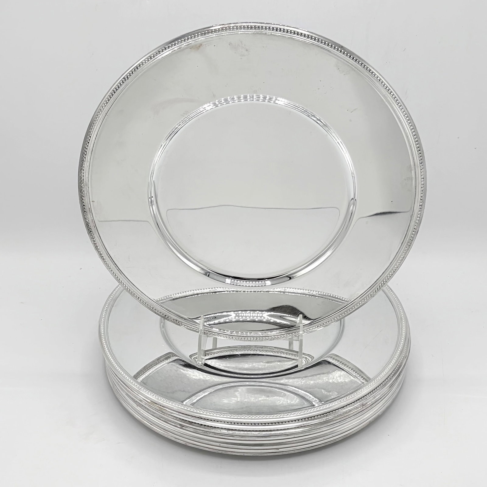 Set of Ten Christofle Silver Plated Chargers: Late 20th century Circular with beaded border. Diameter 11 3/4 inches.