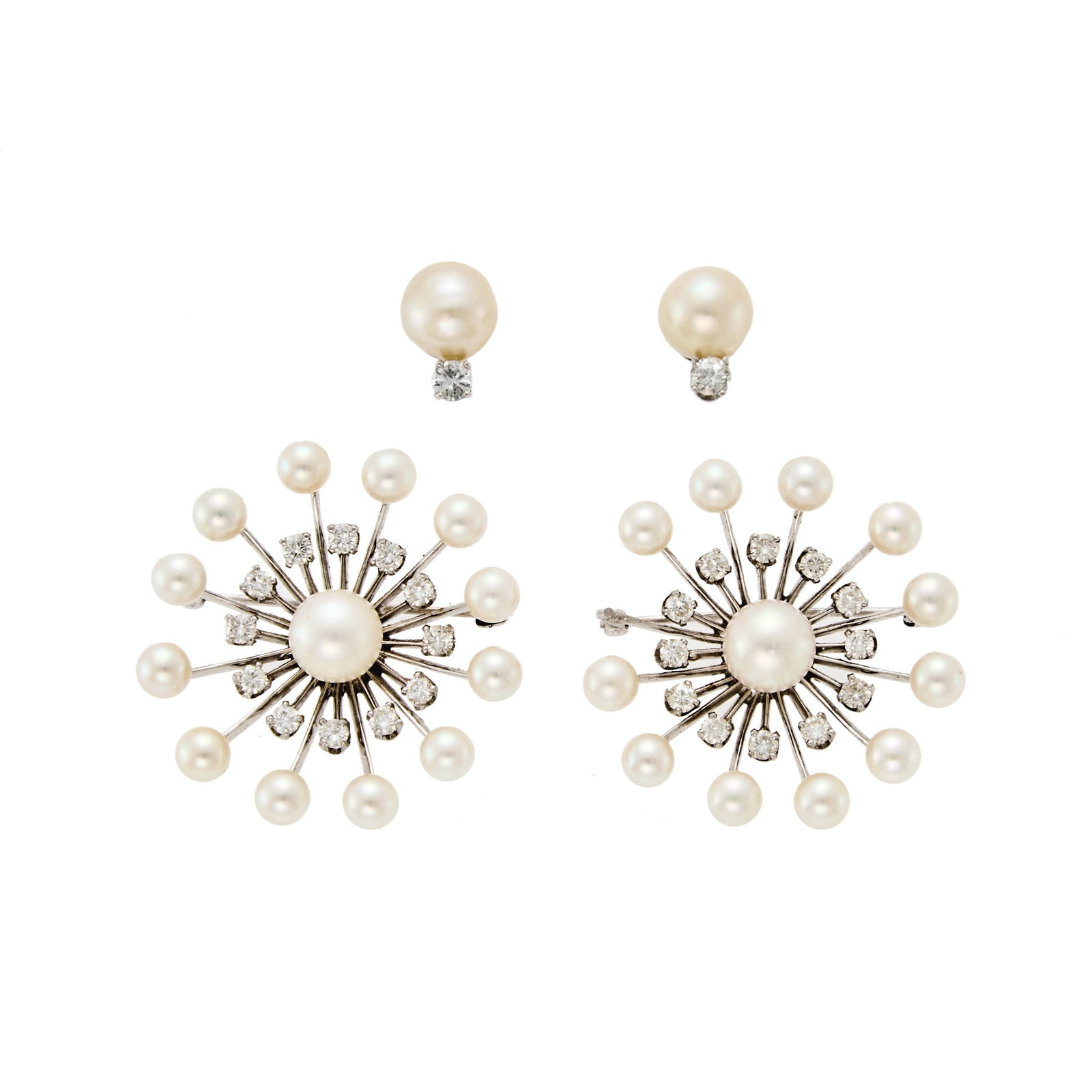 Pair of White Gold, Cultured Pearl and Diamond Brooches and Pair of Earrings: 14 kt., pearls ap. 9.5 to 5.2 mm., 26 round diamonds ap. 2.90 cts., ap. 14.5 dwts. gross. Pearls: whiteish-cream to creamy-white body, pink to golden overtones, good luster. Diamonds: