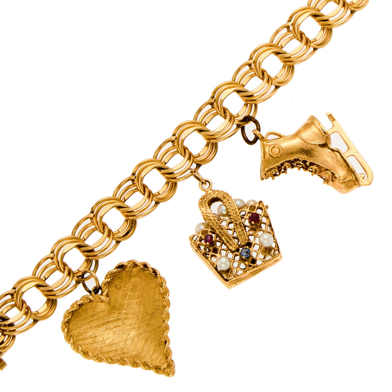 Gold and Gem-Set Charm Bracelet: 14 kt., small round rubies and sapphires, ap. 33.7 dwts. Inner cir. 6 3/4 inches. Stamped or tests as 14 kt.