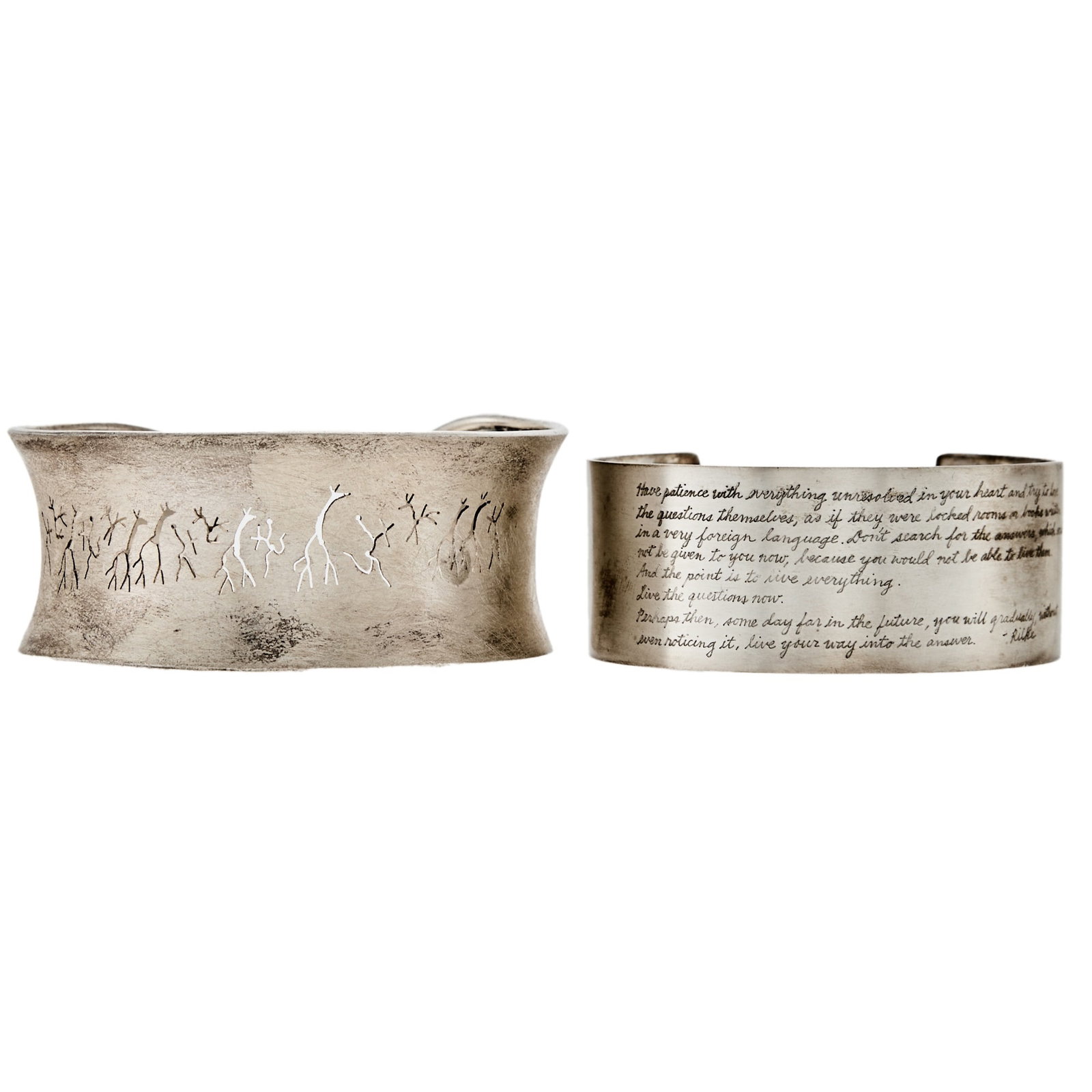 Two Silver Cuff Bangle Bracelets: One with script engraving, ap. 43 dwts. gross. Inner cirs. 7 3/4 to 7 inches, with open backs. Both with some tarnish throughout metal. Widths: 1 1/8 to 1 inch.