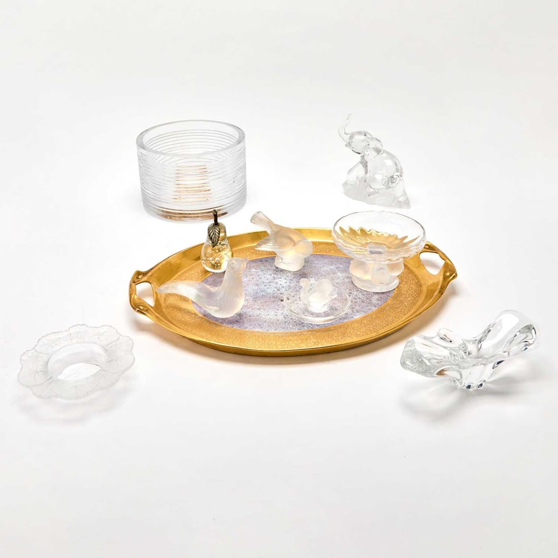 Group of Colorless Glass Articles: Comprising four Lalique molded glass table articles, including a Swan ashtray, a low compote with four birds, and a figure of a bird; a Ralph Lauren "Dobson" cut glass bowl, with a body cut with horiz