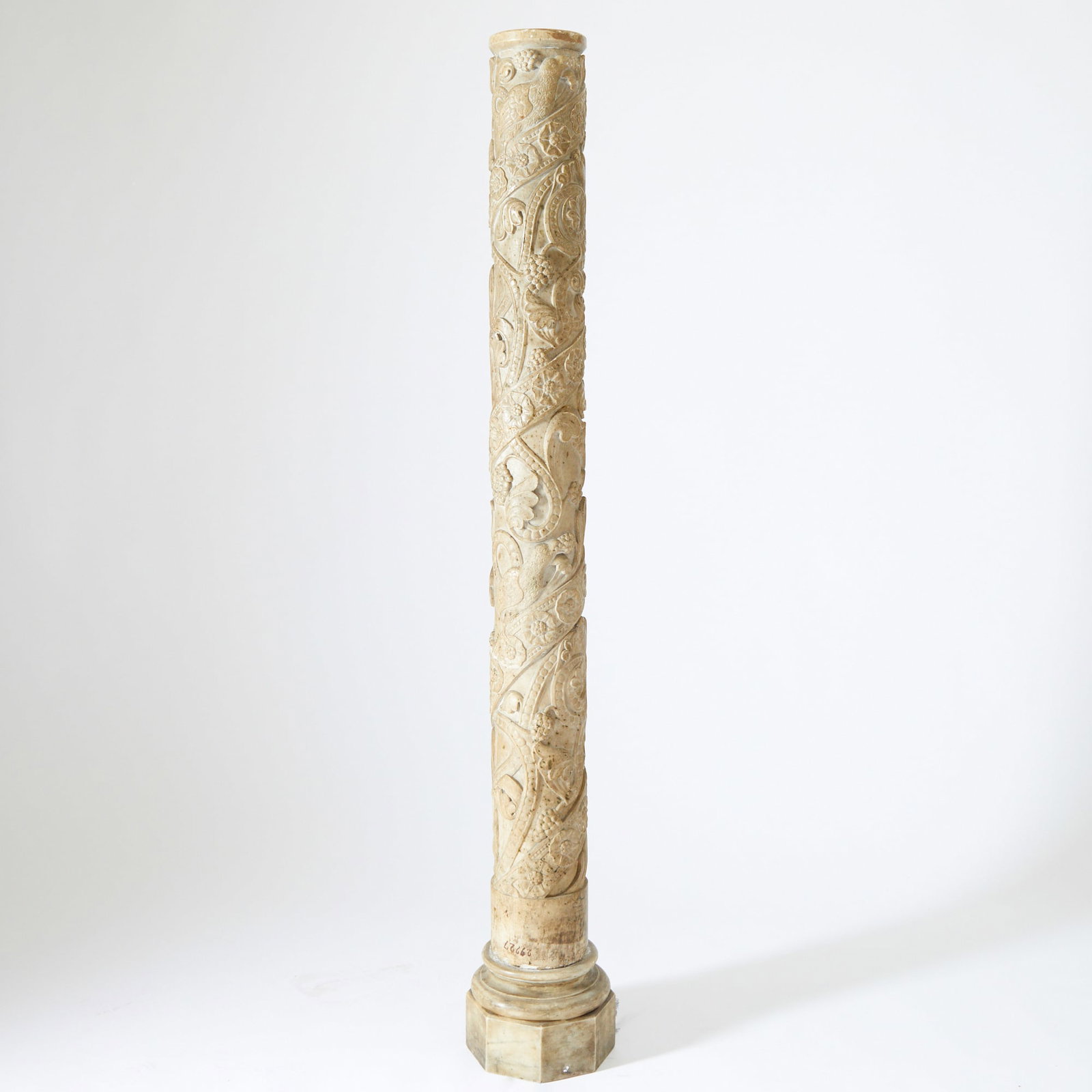 Italian Carved White Marble Column: Mid-19th Century Carved with spiraling floral motifs and fantastic birds and anthropomorphic elements. Height 57 1/2 inches (146 cm).