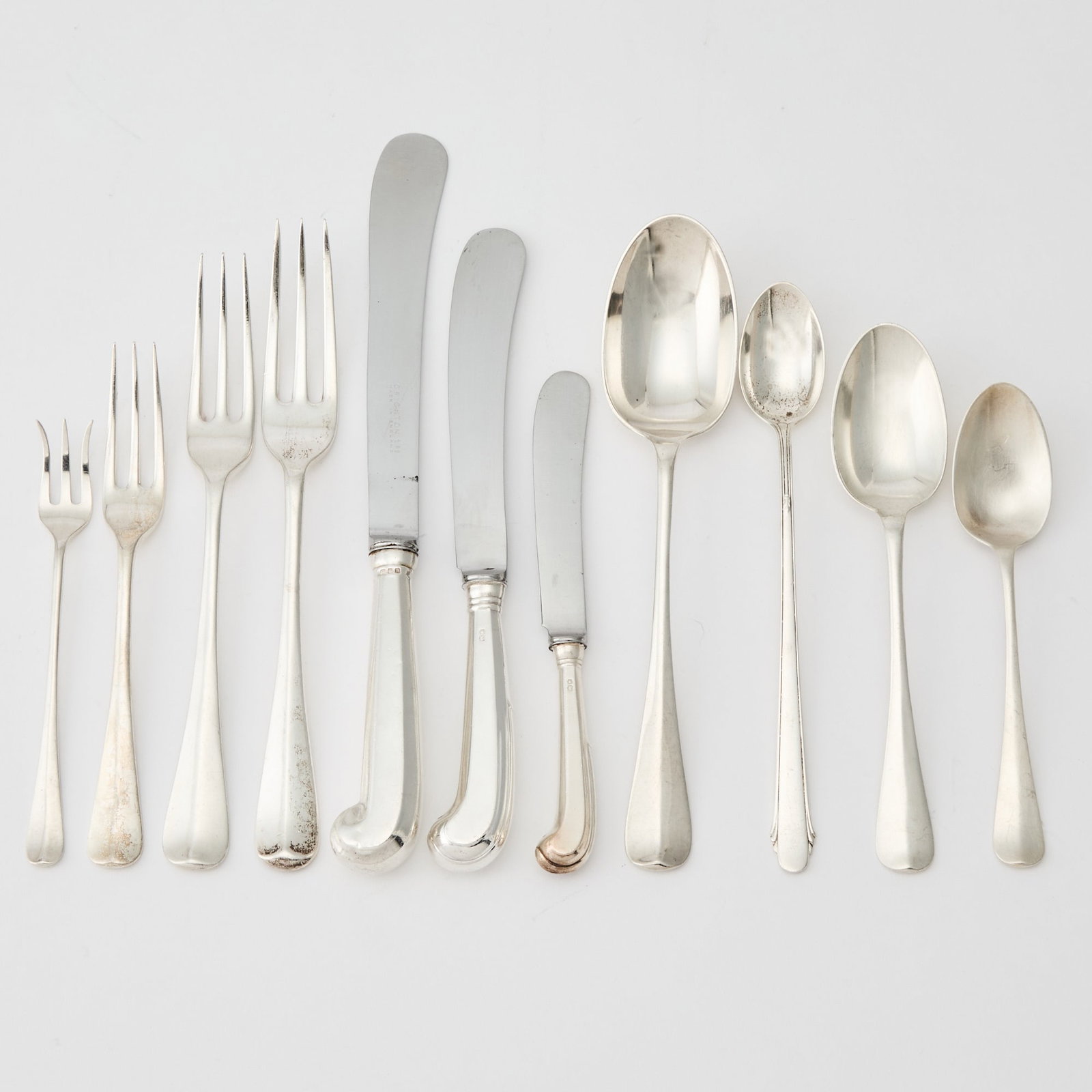 Assembled English and American Sterling Silver Part Flatware Service: Largely 20th century, various makers Comprising: Ten dinner forks Eleven lunch forks Fourteen cocktail forks Thirty dinner knives Thirty-one lunch knives Sixteen butter knives Seven iced tea spoons Ei