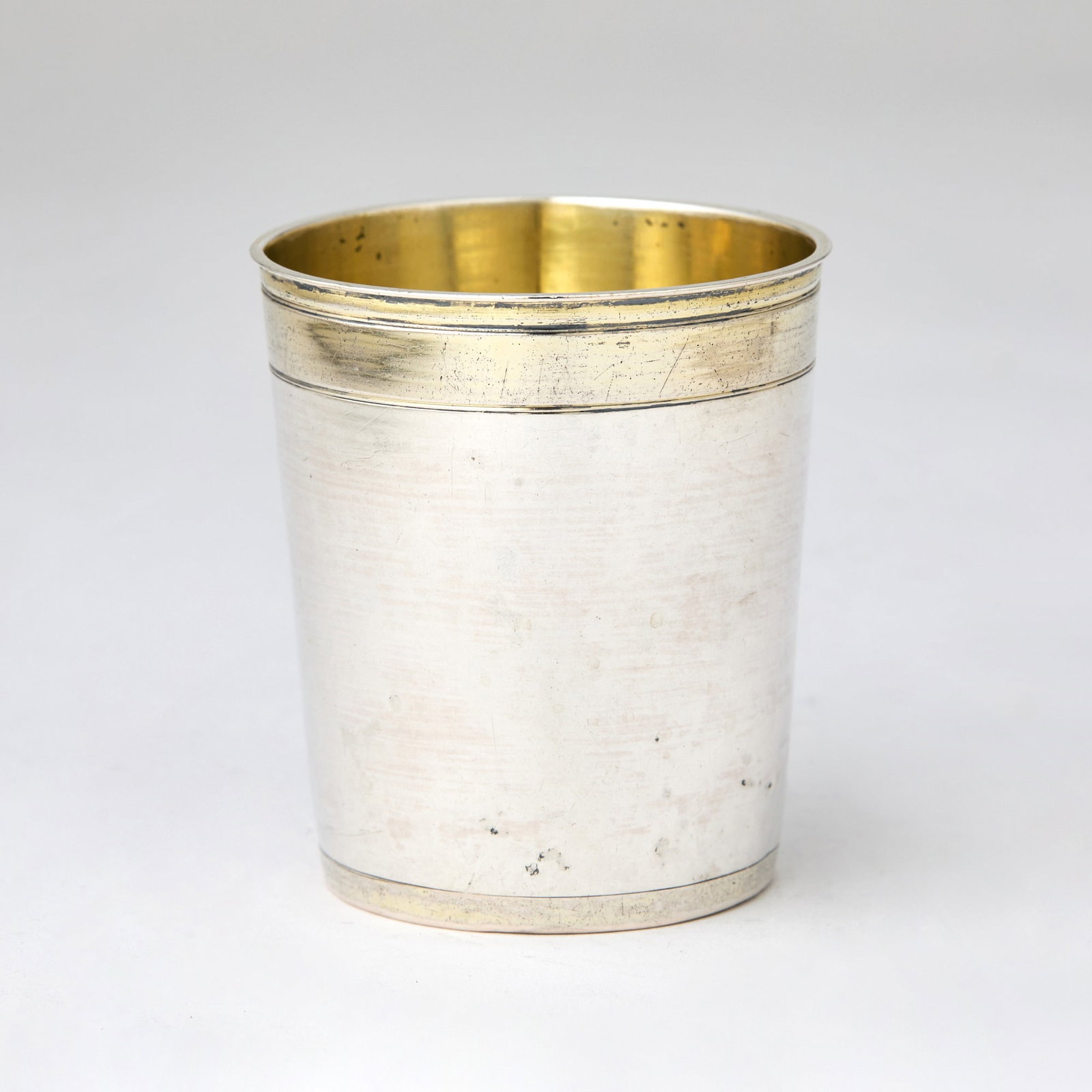 German Silver and Parcel Gilt Beaker: Maker's mark "MB", Augsburg, 17th century Cylindrical with gilt bands. Height 3 inches (7.5 cm), approximately 2 ounces.