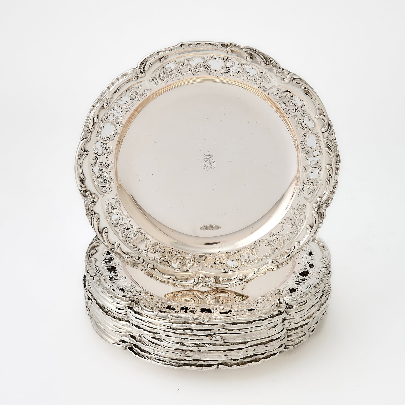 Set of Twelve Austrian Silver Side Plates: Retailed by Antal Bachruch, Budapest, early 20th century Shaped circular with pierced rocaille border, the rim applied with foliate scrolls. Diameter 8 inches (20.3 cm), total approximately 126