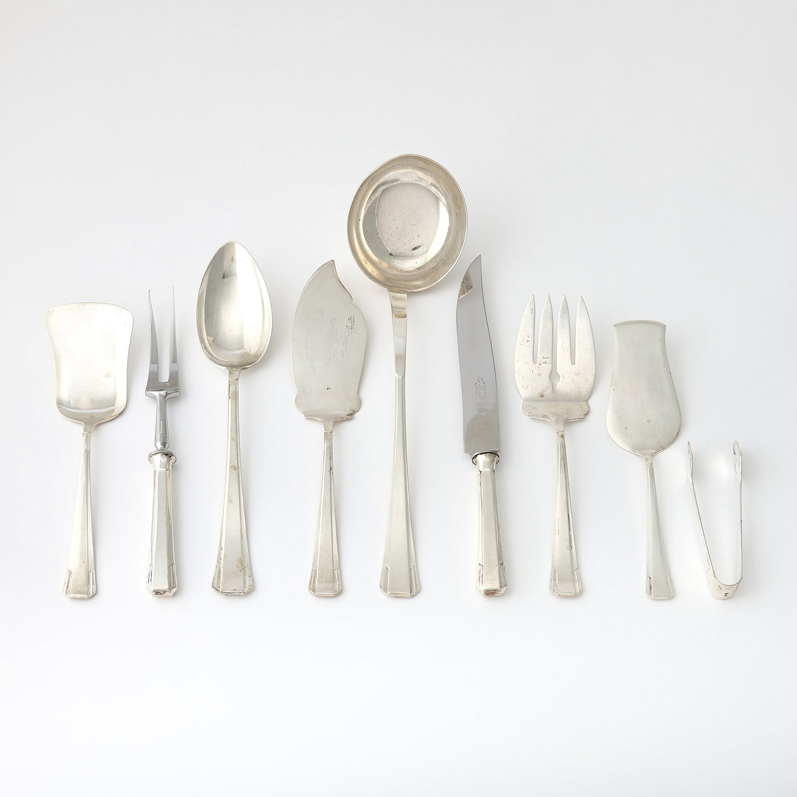 Cased Extensive Continental Silver Flatware Service: Early 20th century Comprising: Drawer One Thirty-two dinner forks Thirty-two dinner knives Soup ladle Drawer Two Eighteen lunch forks Eighteen lunch knives Eighteen