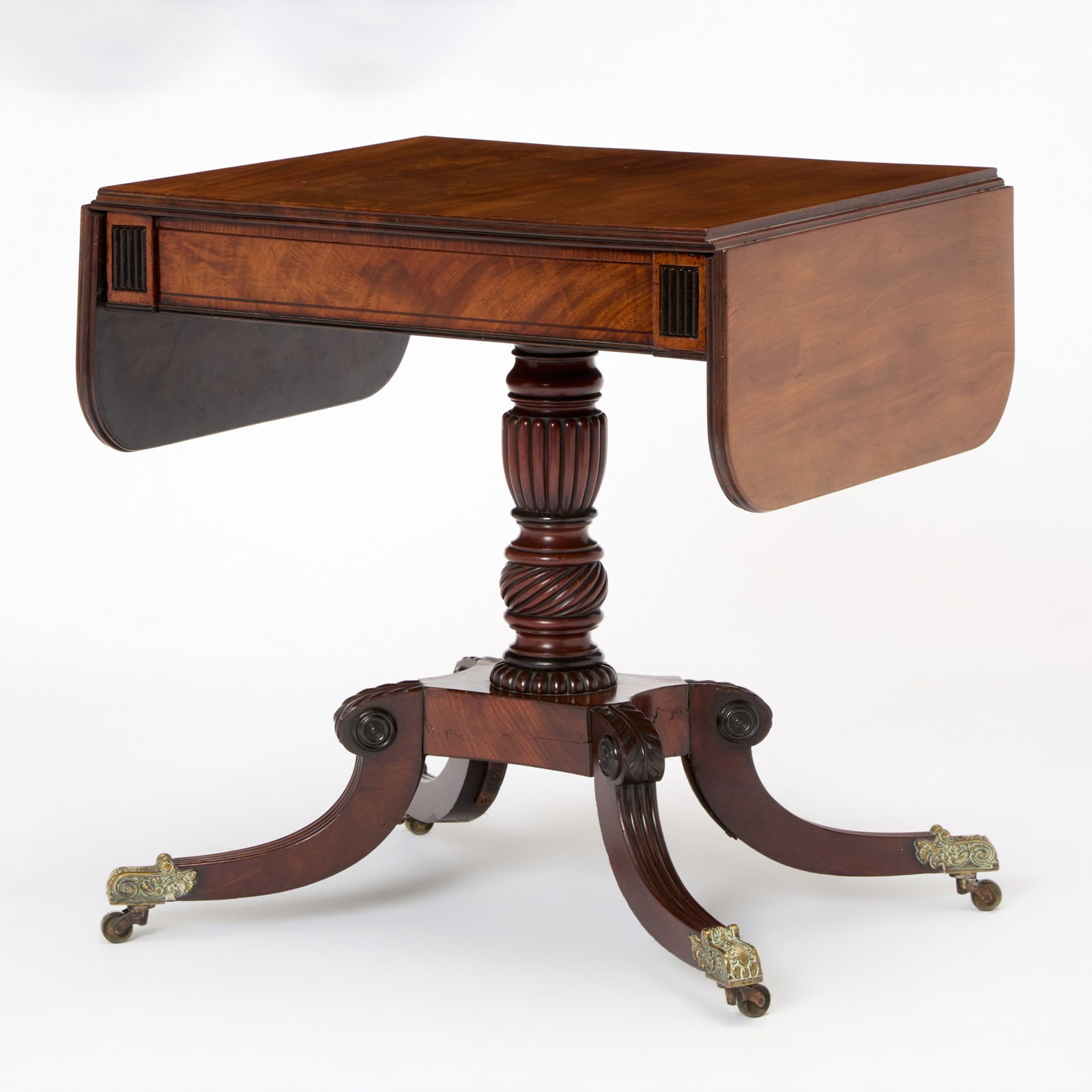Regency Mahogany Sofa Table: First quarter 19th century Height 30 inches (76 cm), width closed 28 inches (71 cm), depth 24 inches (61 cm); width open 47 inches (119.5 cm). Provenance: John Barry, Barton End Hall, Gloucestershire