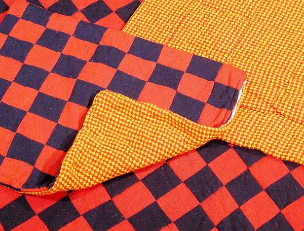 Rudi Gernreich Bed Set: Rudi Gernreich Bed Set American, 1971 Red and black checkerboard reversing to marigold and red harlequin wool jersey king size quilt, 16 x 8 feet, with pillow case, 23 1/2 x 18 inches, each labeled: