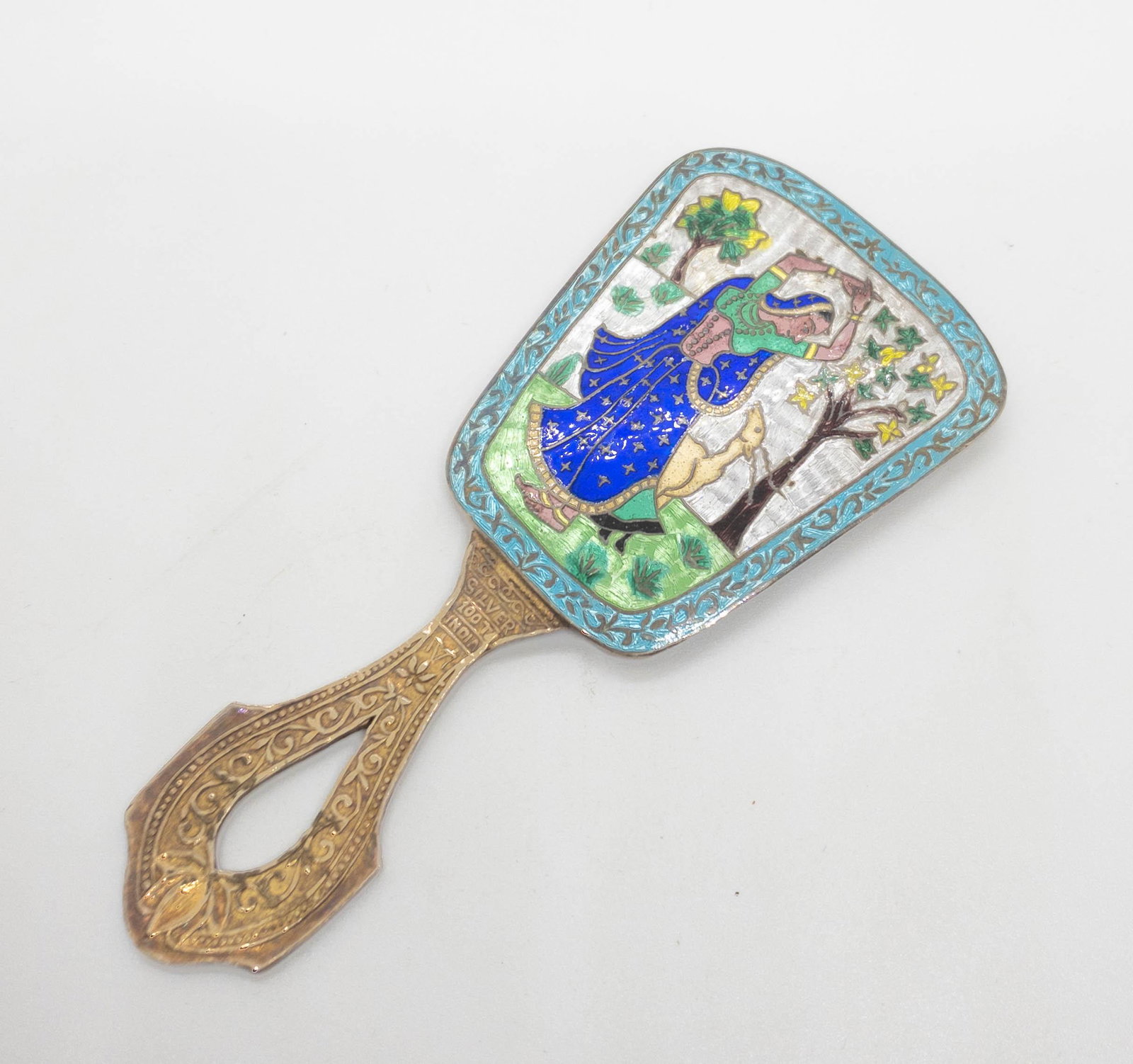 Antique Brass & Enamel Indian Purse Hand Mirror: Antique purse / hand mirror featuring a highly detailed colorful enamel scene of a woman dancing, a deer and trees. 4.5" long x 2" wide