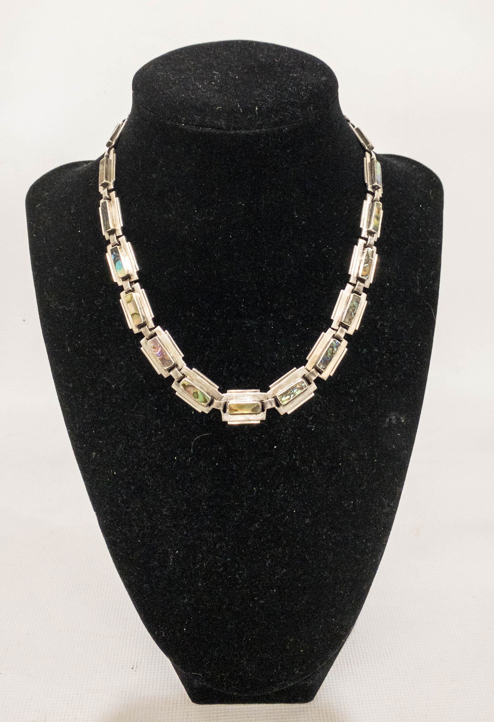 Taxco Mexico Sterling SIlver Abalone Panel Link: Taxco Mexican sterling silver necklace in a panel link design with each panel measuring 6.5 x 1.25mm and boasting a raised bezel set abalone bar. Secure push clasp. Stamped: Hecho en Taxco MÃ©xico,