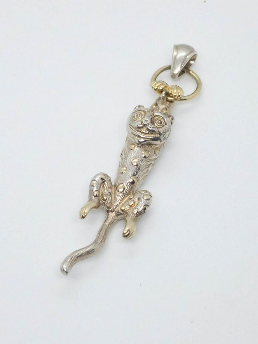 Sergio Bustamante Mexico Sterling Silver Cheshire Cat: Sergio Bustamante sterling silver, highly detailed cheshire cat hanging from a hoop by his front paws. Signed: Sergio Bustamante, 925, Mex. 2.75" long. Weight: 16.9 grams.