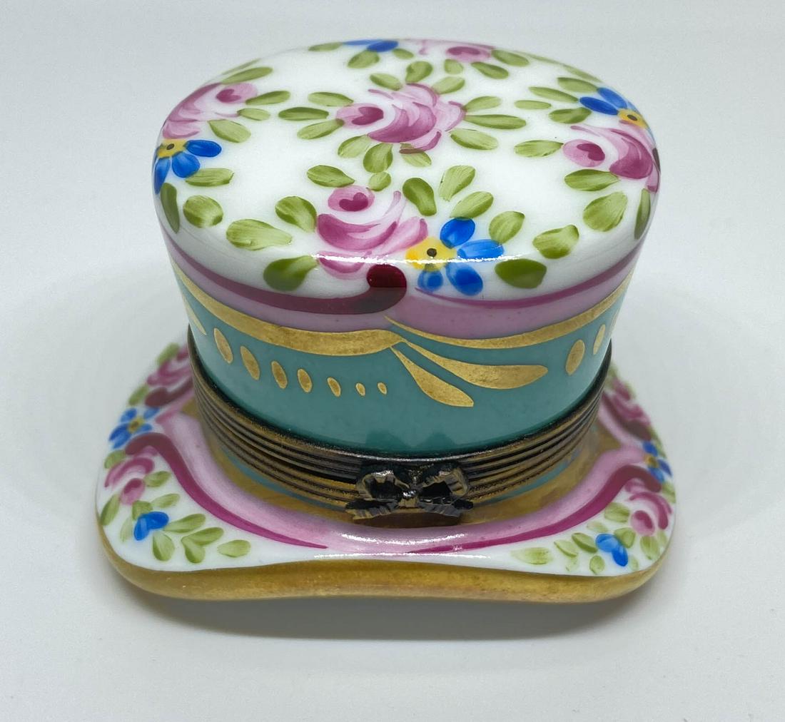 Limoges France Peint Main Hat Box with Perfume Bottle: Vintage porcelain hat shaped box with a perfume bottle inside. Marked: Peint main, G.R. Limoges France. 1.5" high x 2.5" long x 1.25" wide.