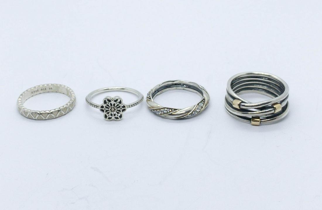 4 Authentic Pandora Sterling Silver Rings: A collection of 4 sterling silver Authentic Pandora rings. 2 are a size 9 and 2 are a size 8. All marked: S 925 ALE. Total weight: 17.6 grams
