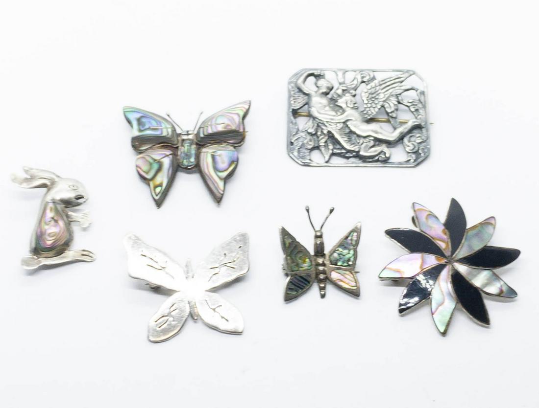Lot of 6 Vintage Sterling silver Brooches: A lot of 6 sterling silver brooches ranging in size from 1" to 1.75" long. The 3 abalone brooches are Mexican sterling. Total weight: 33.3 grams