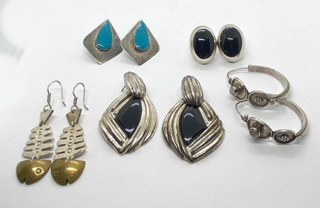 Lot of Sterling Earrings Turquoise Moonstone: 5 pair of sterling silver earrings: drop free form earrings with onyx centers, Mexico, 2" long, oval earrings with onyx centers, Mexico, 1" long, fish bone earrings with gold washed heads, Mexico, 2.5