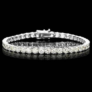 18k White Gold 12.00ct Diamond Tennis Bracelet: Retail: $49,600.00 ****** 18k White Gold 12.00ct Diamond Tennis Bracelet ****** Metal: 18k Solid White Gold / Size: 7.5 / Total Item Weight: 14.0 grams / Country Made: United States / / Main Stone: Di