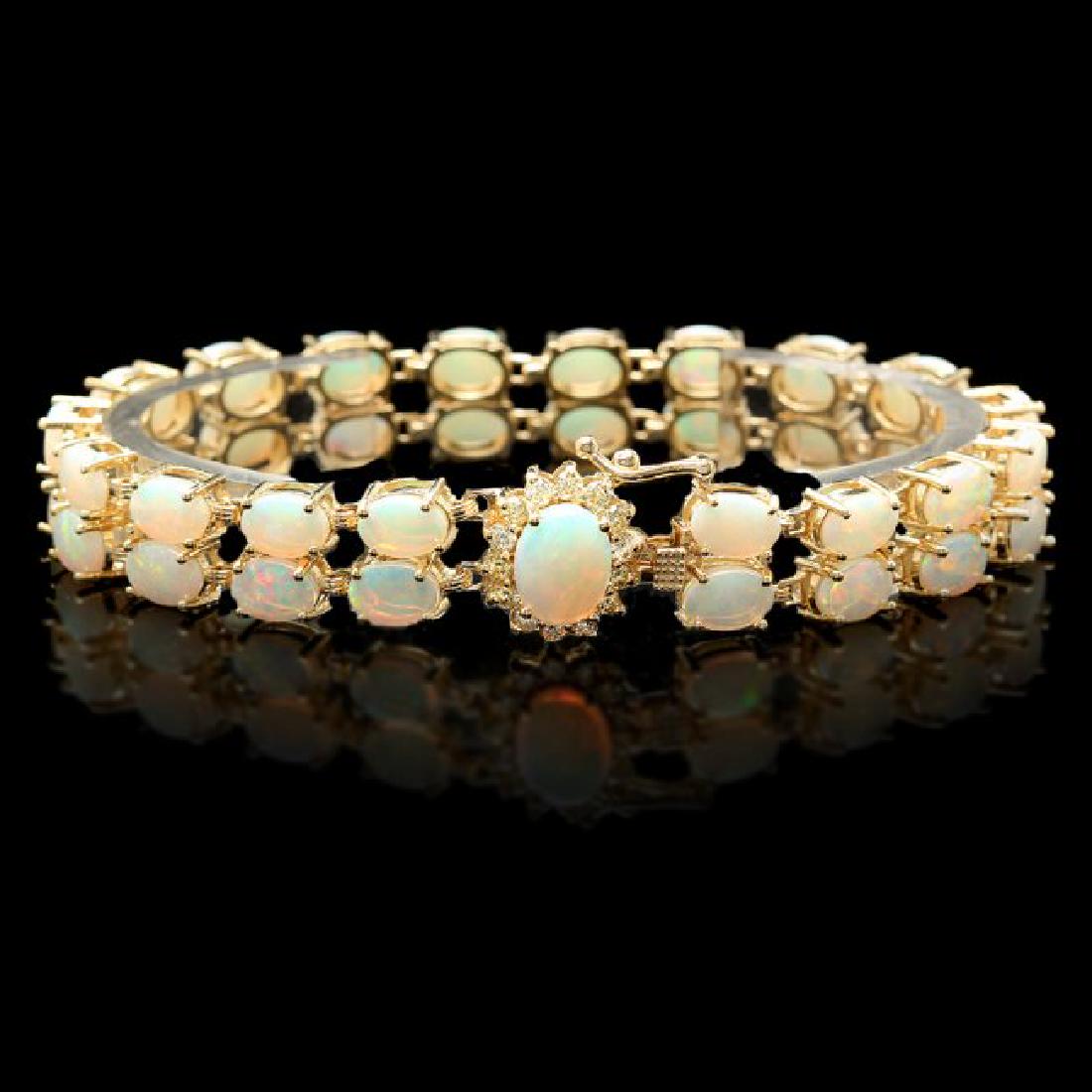14k Gold 14.1ct Opal 0.50ct Diamond Bracelet: Retail: $21,500.00 ****** 14k Gold 14.1ct Opal 0.50ct Diamond Bracelet ****** Metal: 14k Solid Yellow Gold / Size: 7 / Total Item Weight: 21.0 grams / Country Made: United States / / Main Stone: Opal 