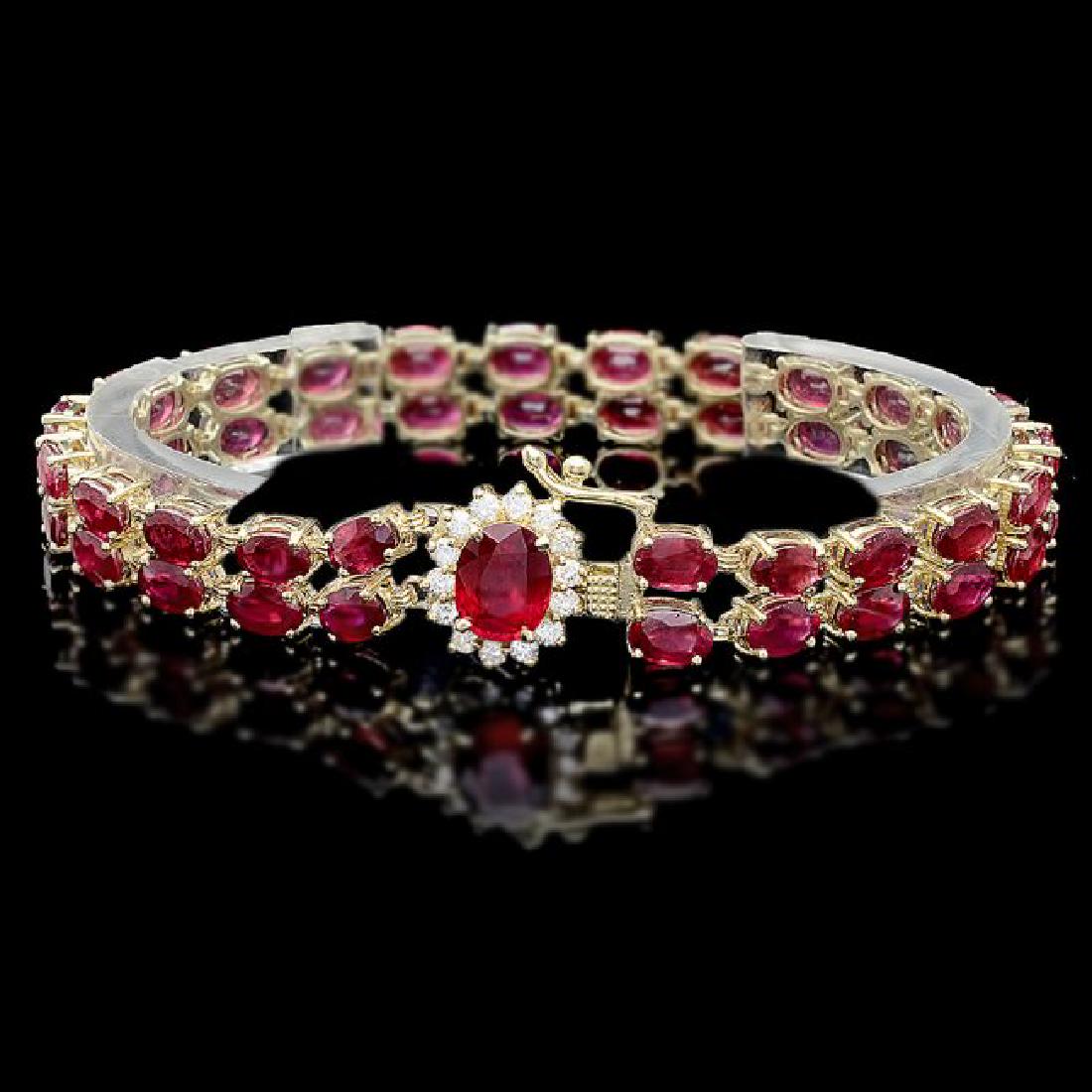 14k Yellow Gold 32ct Ruby 0.60ct Diamond Bracelet: Retail: $16,100.00 ****** 14k Yellow Gold 32ct Ruby 0.60ct Diamond Bracelet ****** Metal: 14k Solid Yellow Gold / Size: 7 / Total Item Weight: 20.5 grams / Country Made: United States / / Main Stone: 